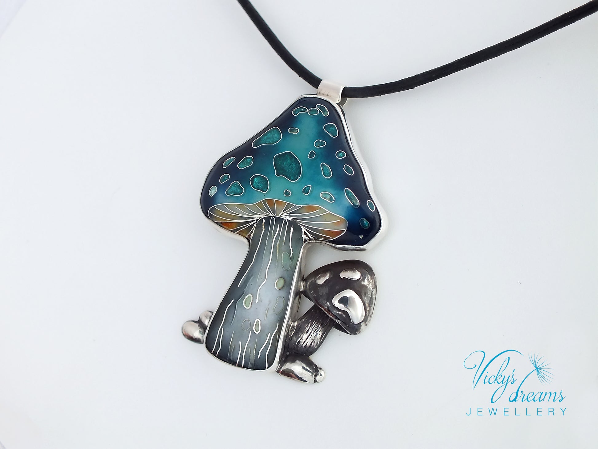 Mushroom-shaped pendant on a black cord against a white background, with 'Vicky's Dreams Jewellery' branding.