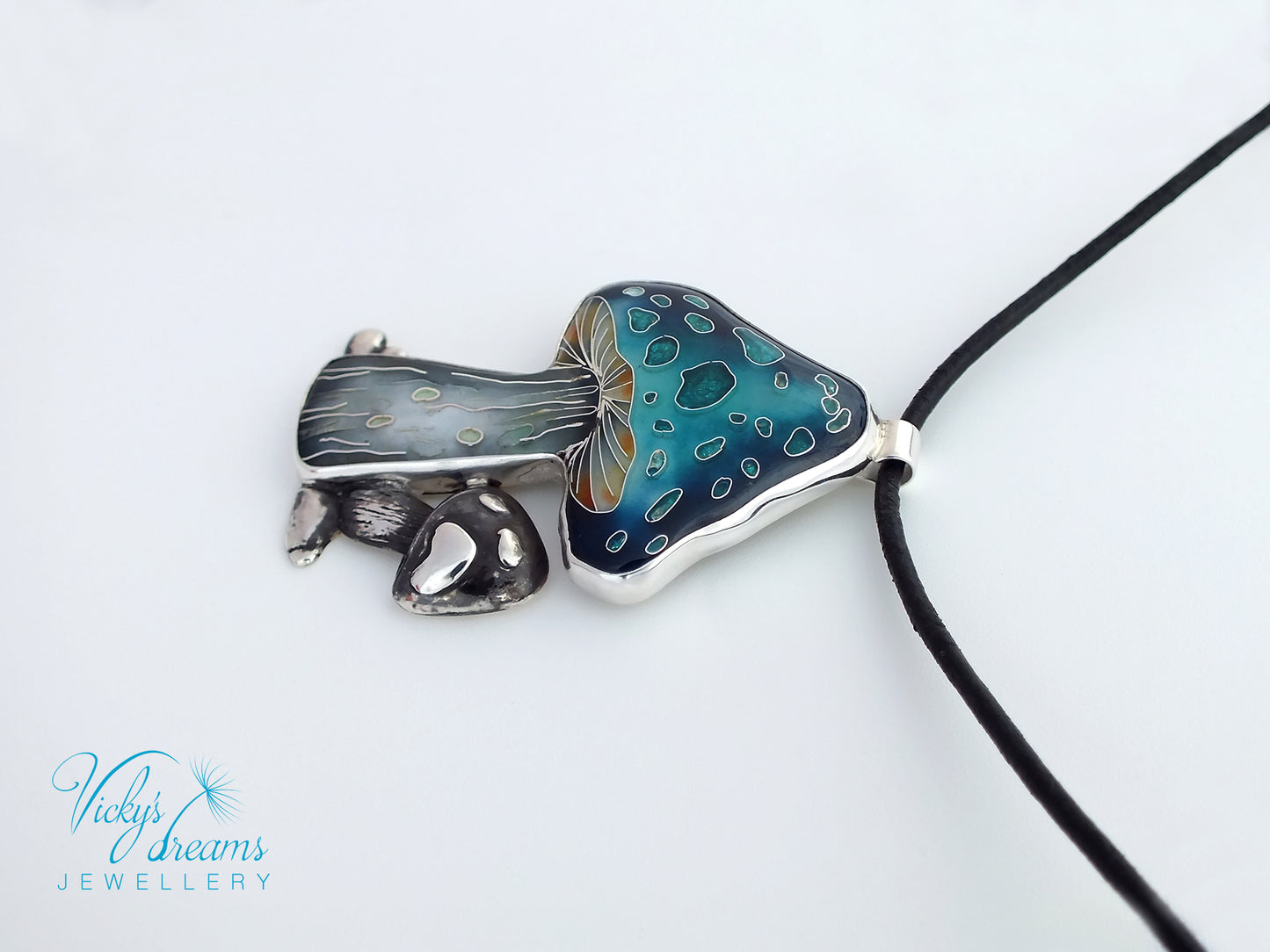Jewelry with a blue and silver pendant on a white background