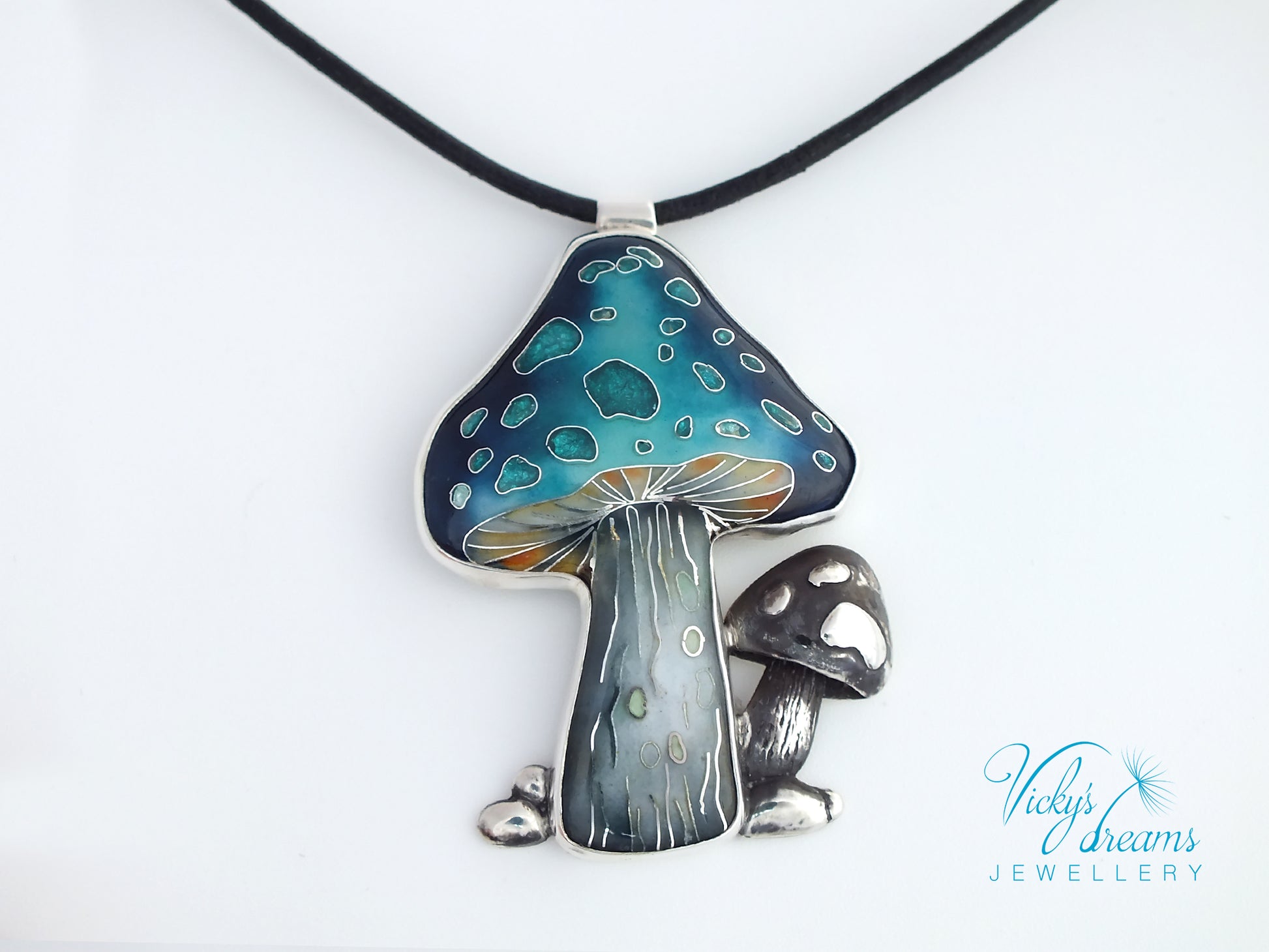 Mushroom-shaped pendant on a black cord against a white background, with 'Vicky's Dreams Jewellery' branding.