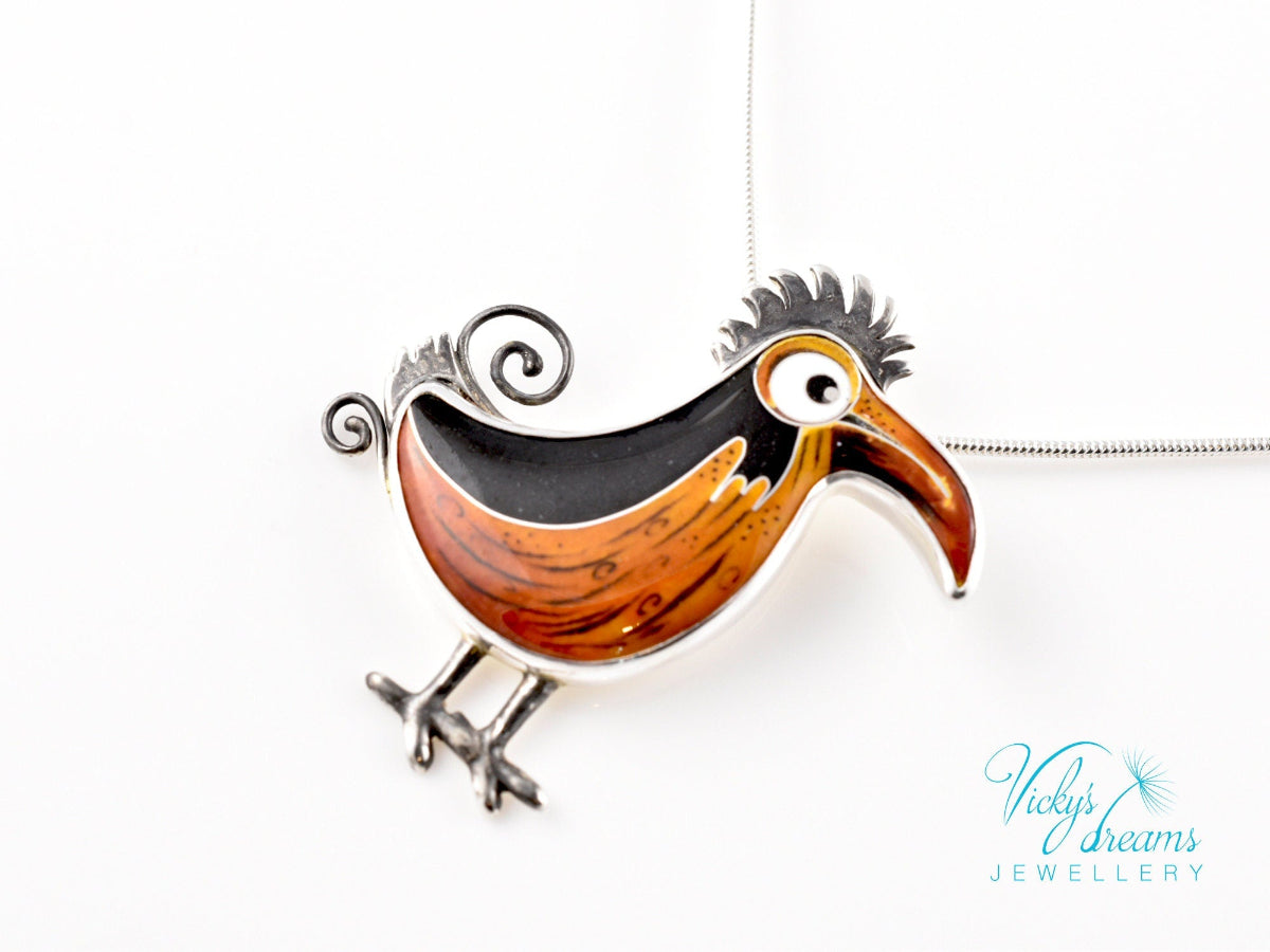 Handcrafted boho birdie pendant with cloisonné enamel and sterling silver frame, unique nature-inspired jewelry piece.