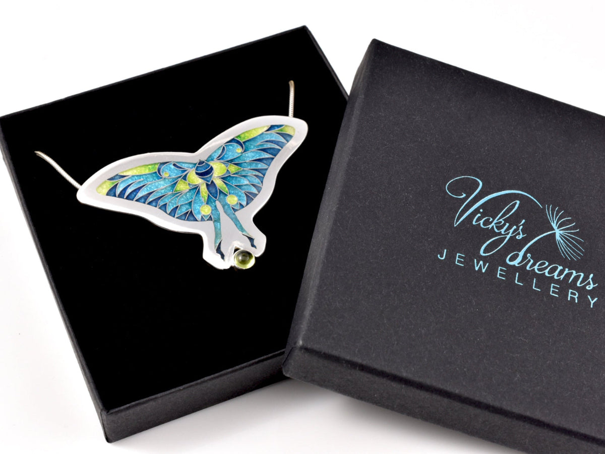 Butterfly-shaped cloisonne pendant with blue and green design