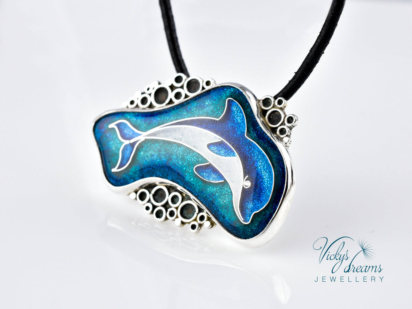 Dolphin pendant necklace on a white background with 'Vicky's Dreams Jewellery' branding.