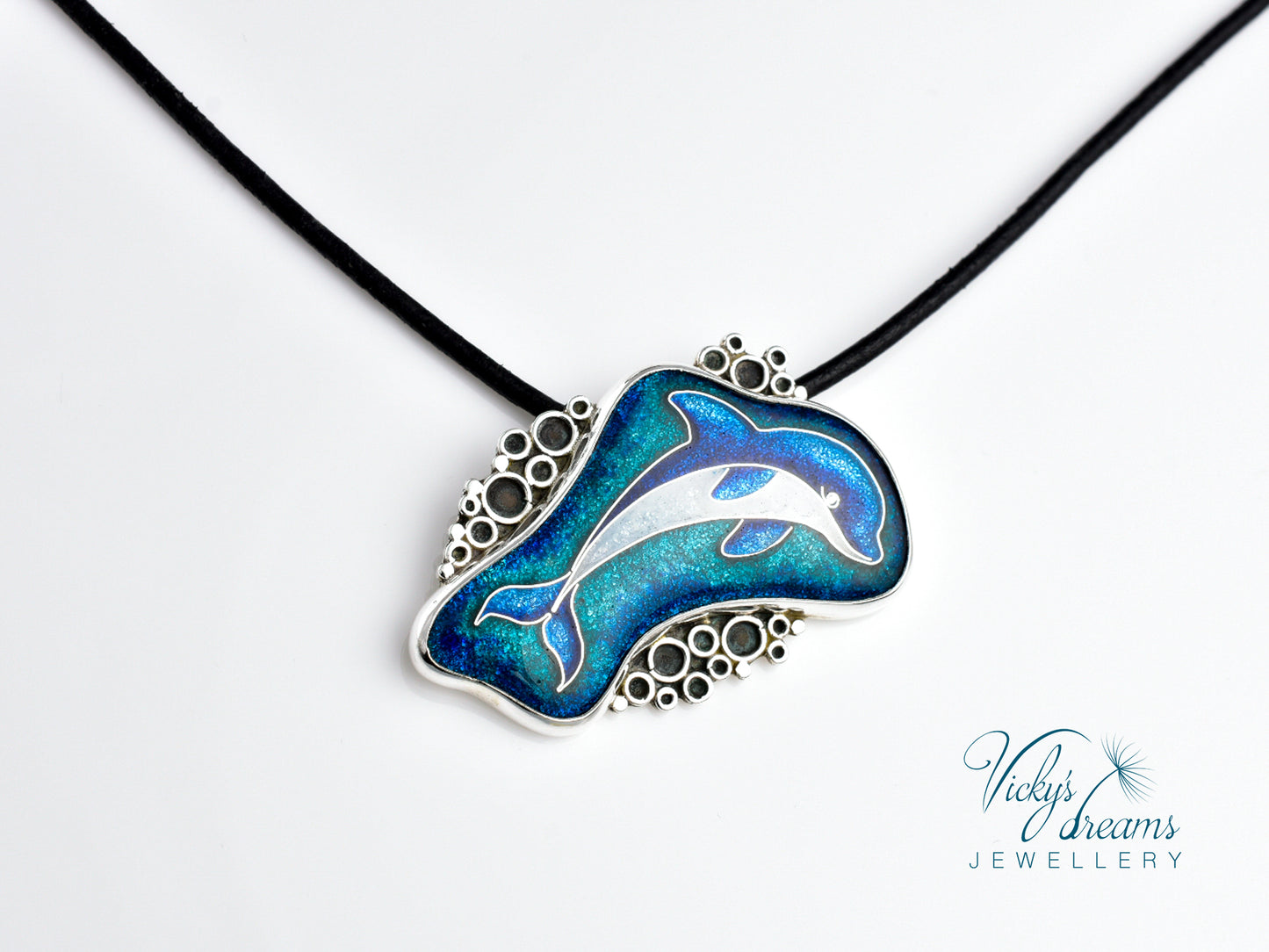 Dolphin pendant necklace on a white background with 'Vicky's Dreams Jewellery' branding.