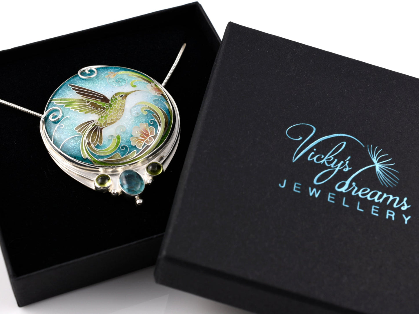 Handcrafted hummingbird pendant with cloisonné enamel and gemstone accents