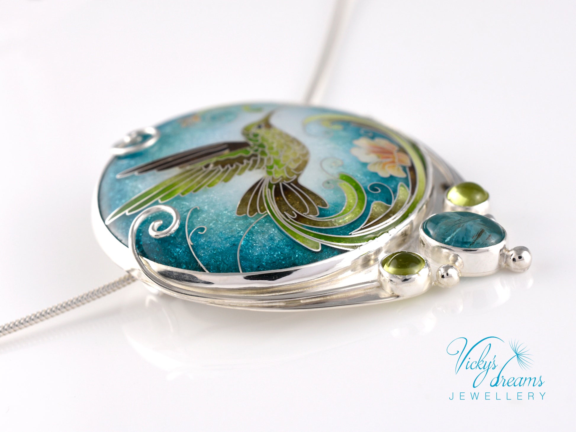 Handcrafted hummingbird pendant with cloisonné enamel and gemstone accents