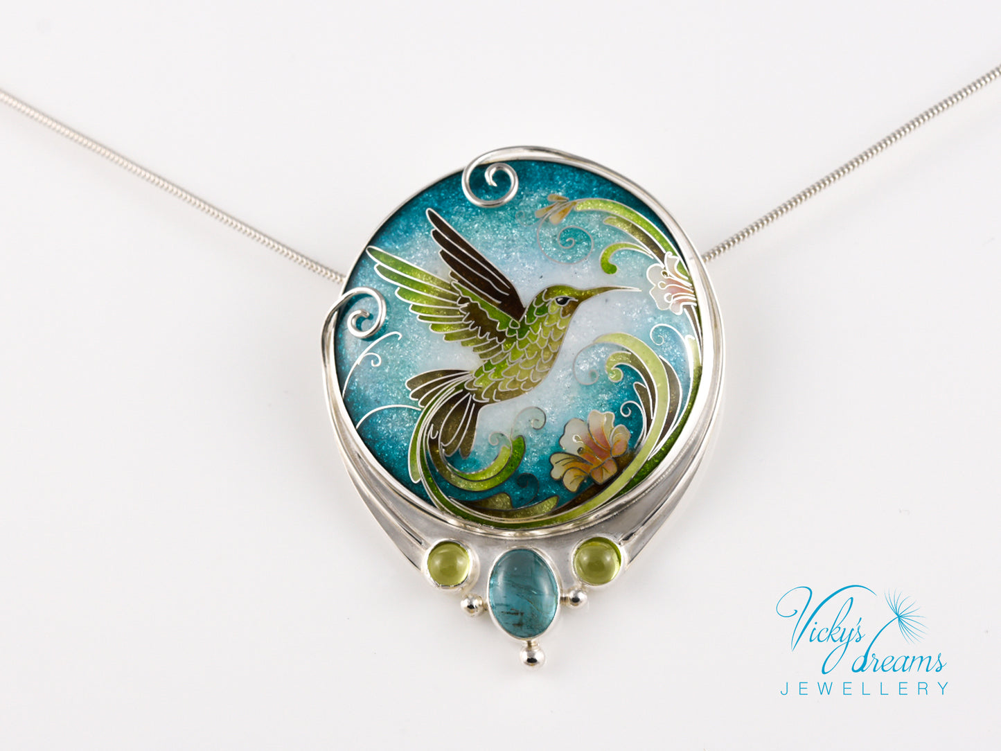 Handcrafted hummingbird pendant with cloisonné enamel and gemstone accents
