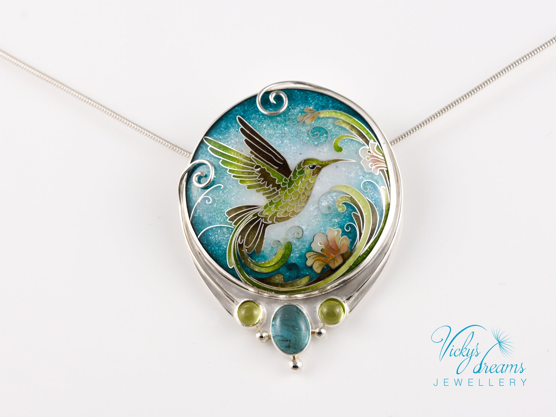 Handcrafted hummingbird pendant with cloisonné enamel and gemstone accents