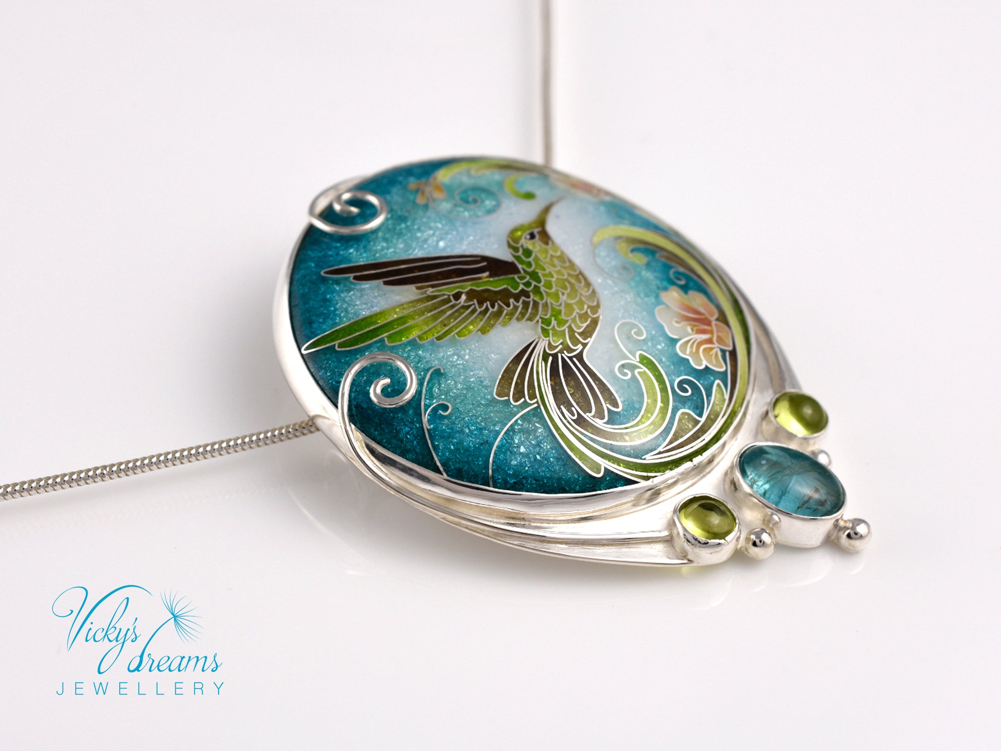 Handcrafted hummingbird pendant with cloisonné enamel and gemstone accents
