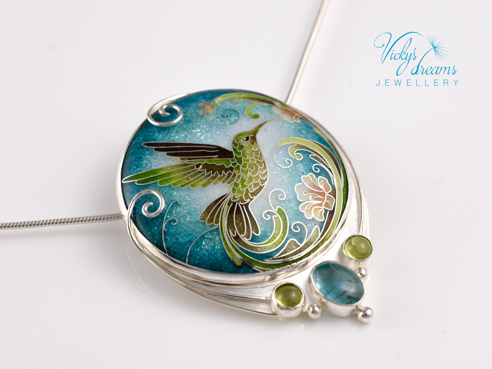 Handcrafted hummingbird pendant with cloisonné enamel and gemstone accents