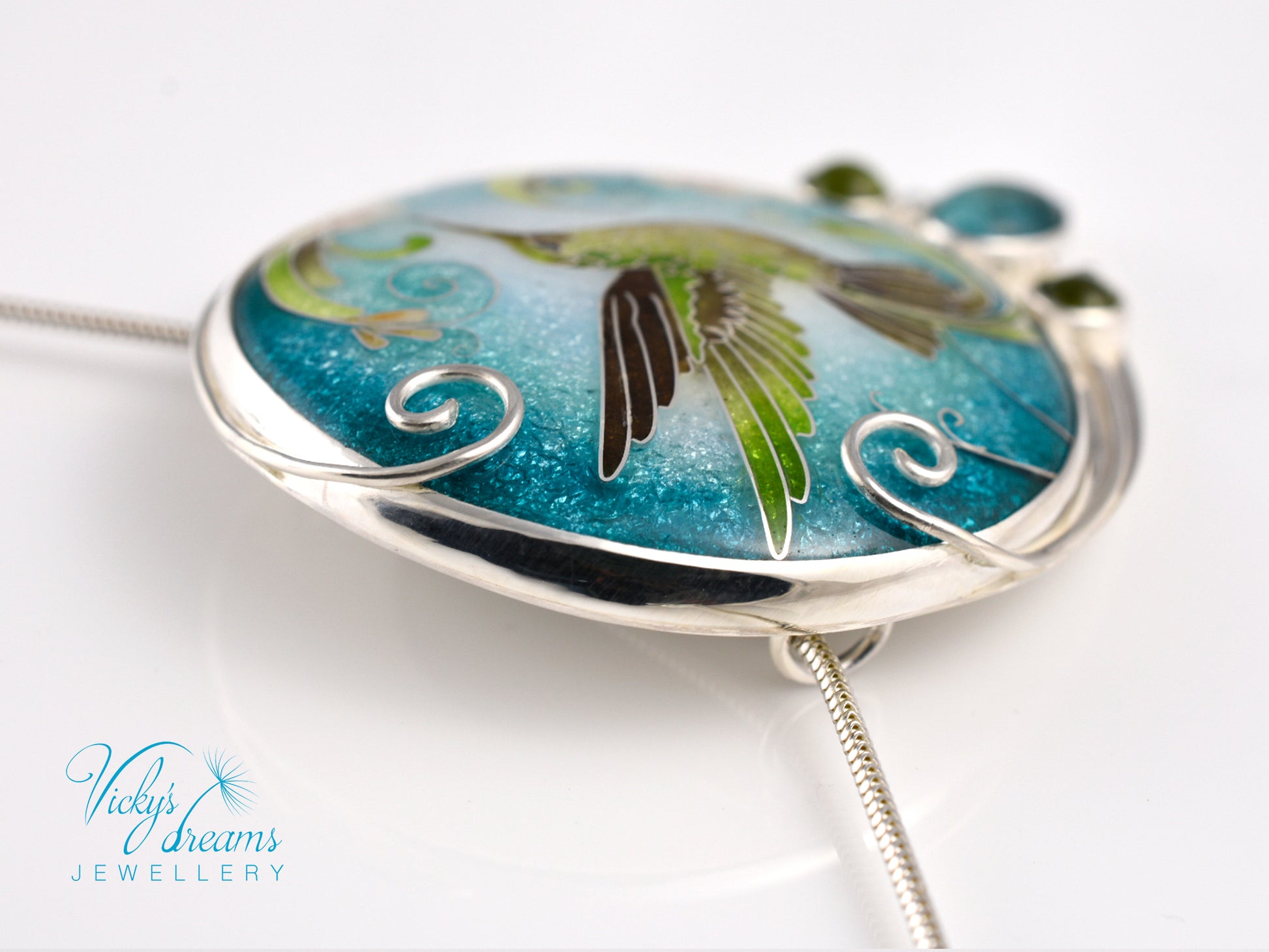 Handcrafted hummingbird pendant with cloisonné enamel and gemstone accents