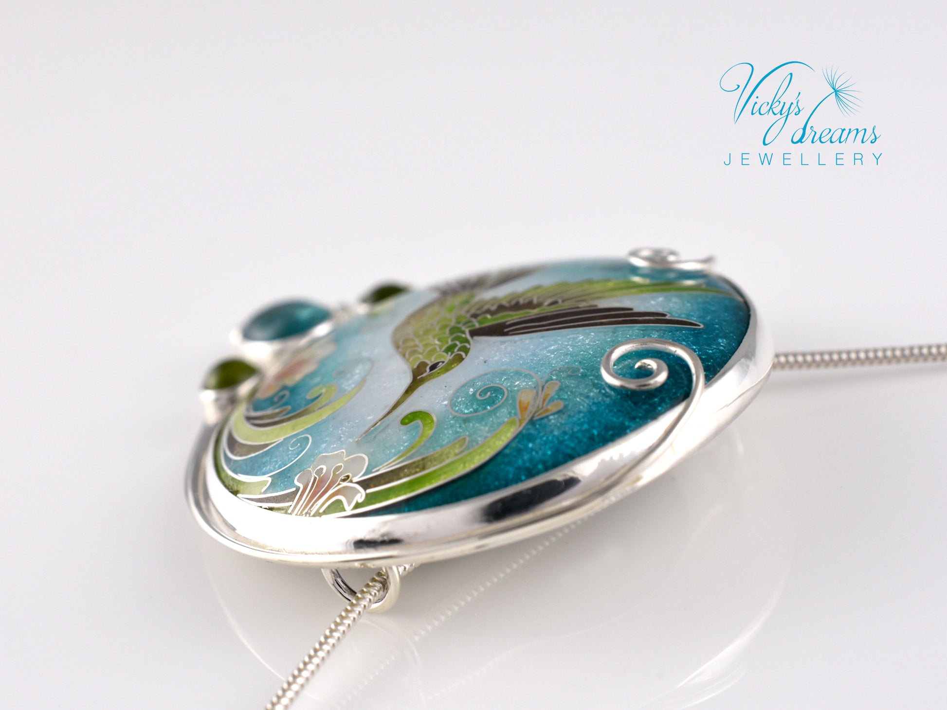 Handcrafted hummingbird pendant with cloisonné enamel and gemstone accents