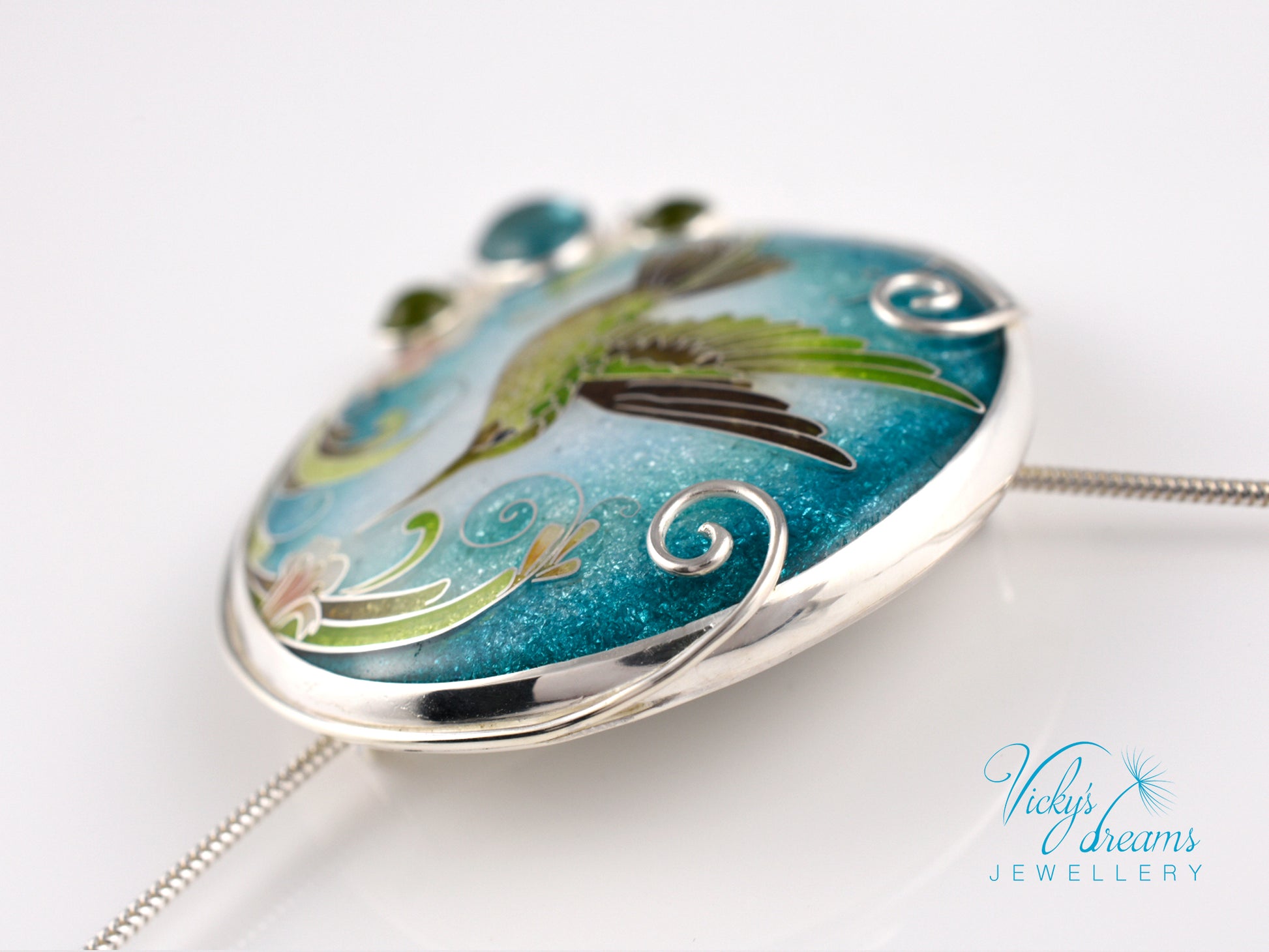 Handcrafted hummingbird pendant with cloisonné enamel and gemstone accents