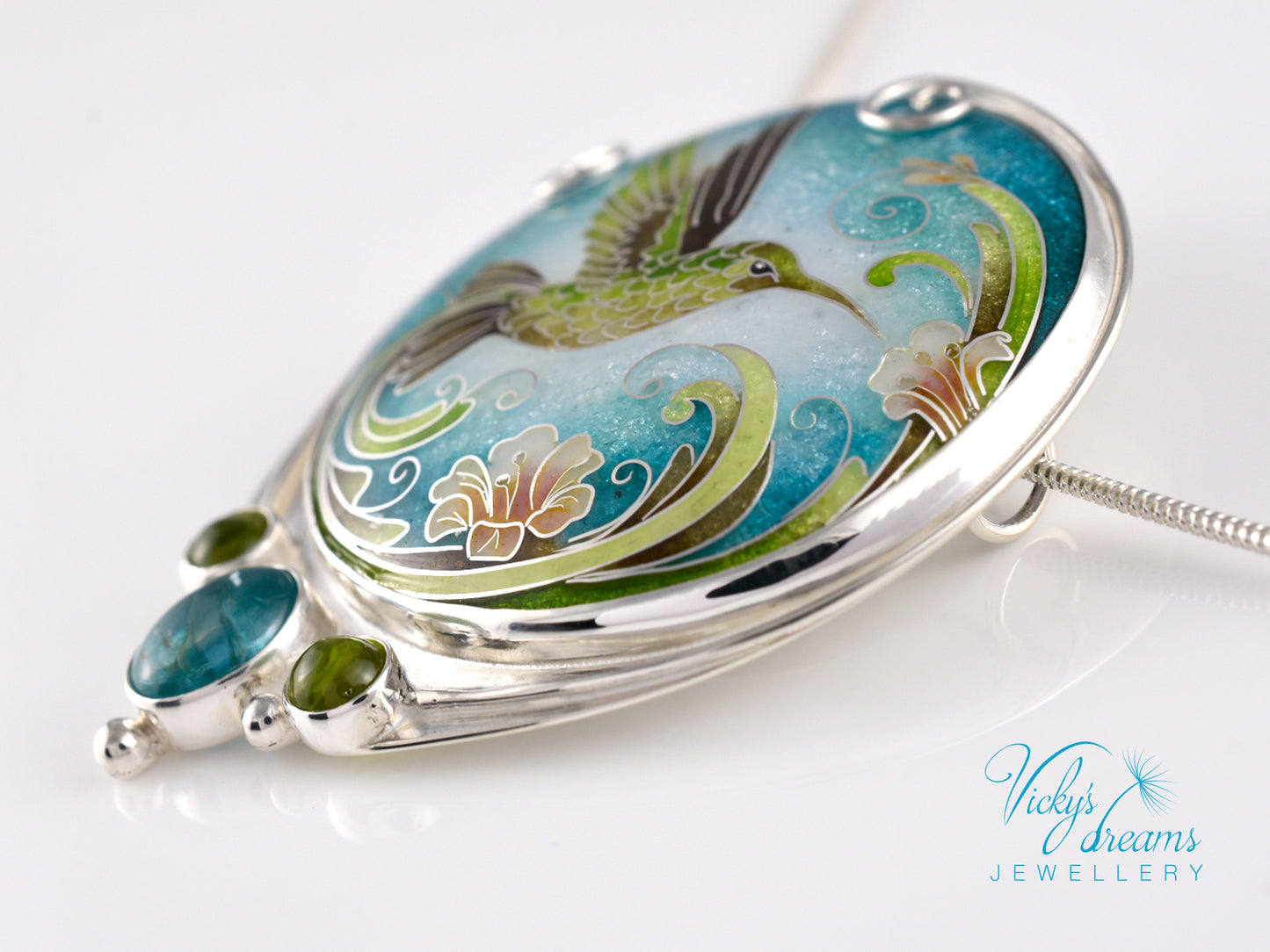 Handcrafted hummingbird pendant with cloisonné enamel and gemstone accents