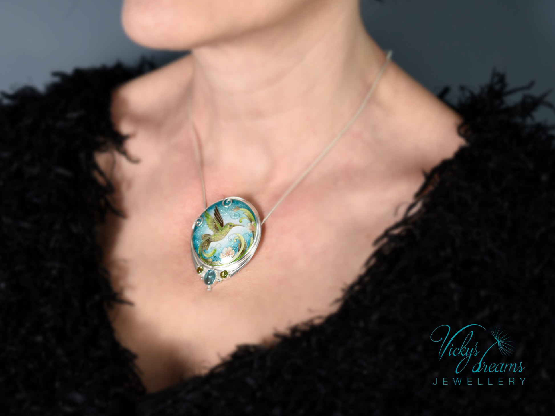 Handcrafted hummingbird pendant with cloisonné enamel and gemstone accents