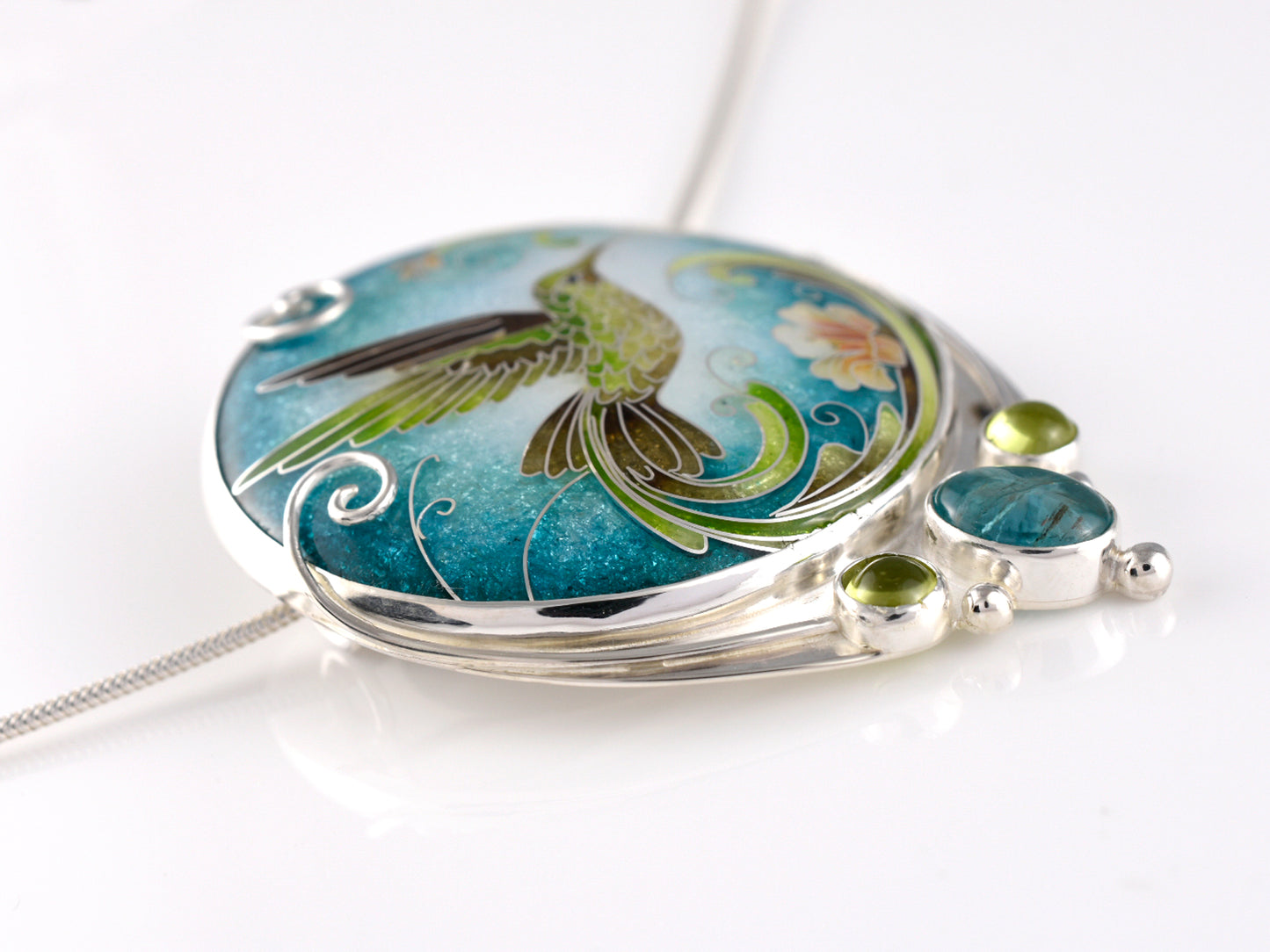 Handcrafted hummingbird pendant with cloisonné enamel and gemstone accents