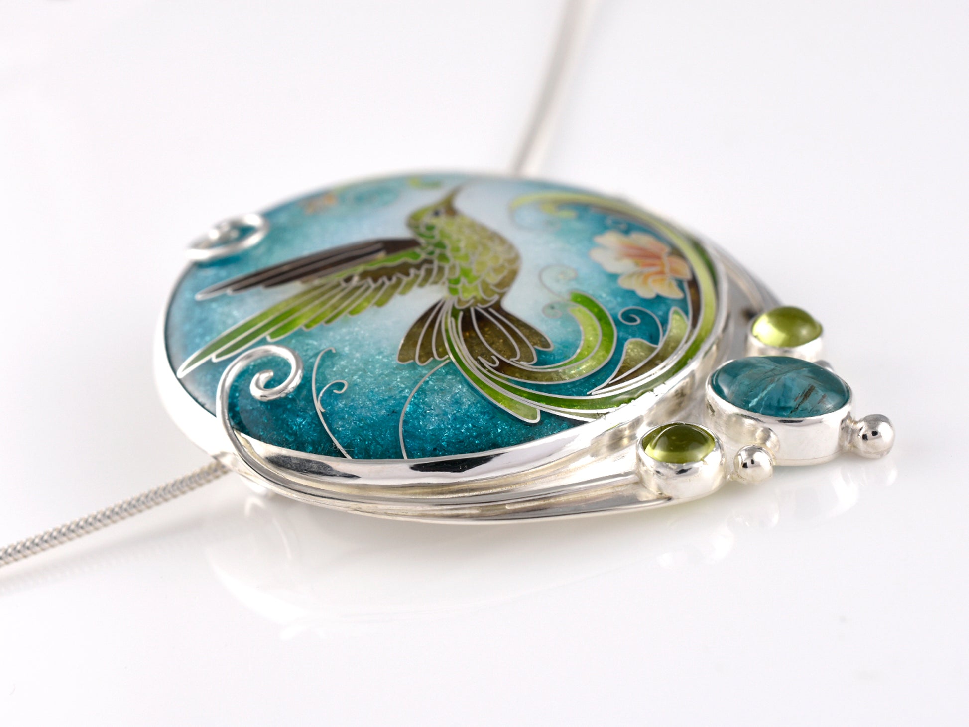 Handcrafted hummingbird pendant with cloisonné enamel and gemstone accents
