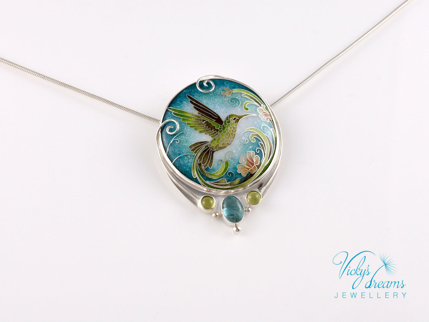 Handcrafted hummingbird pendant with cloisonné enamel and gemstone accents