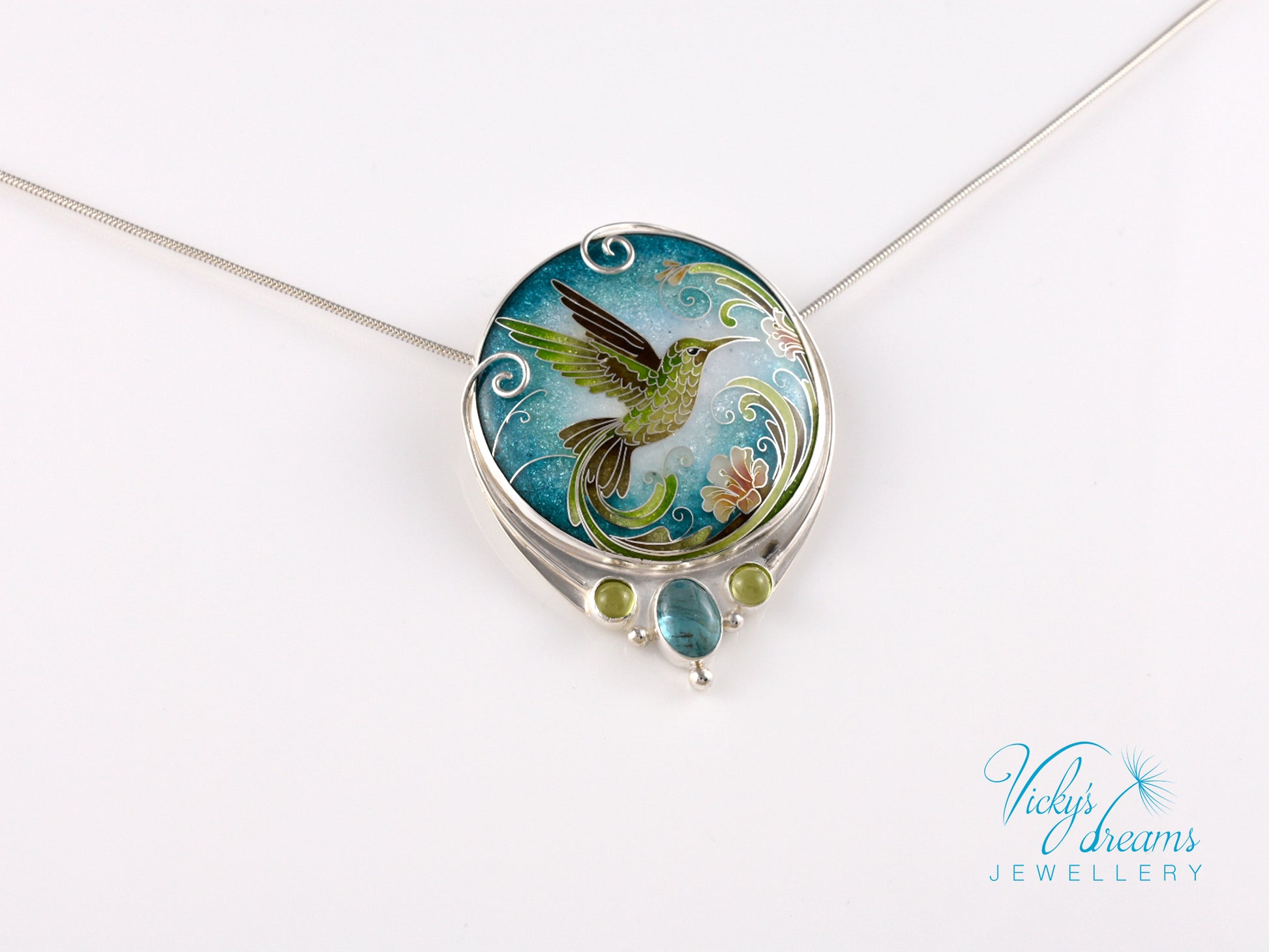 Handcrafted hummingbird pendant with cloisonné enamel and gemstone accents