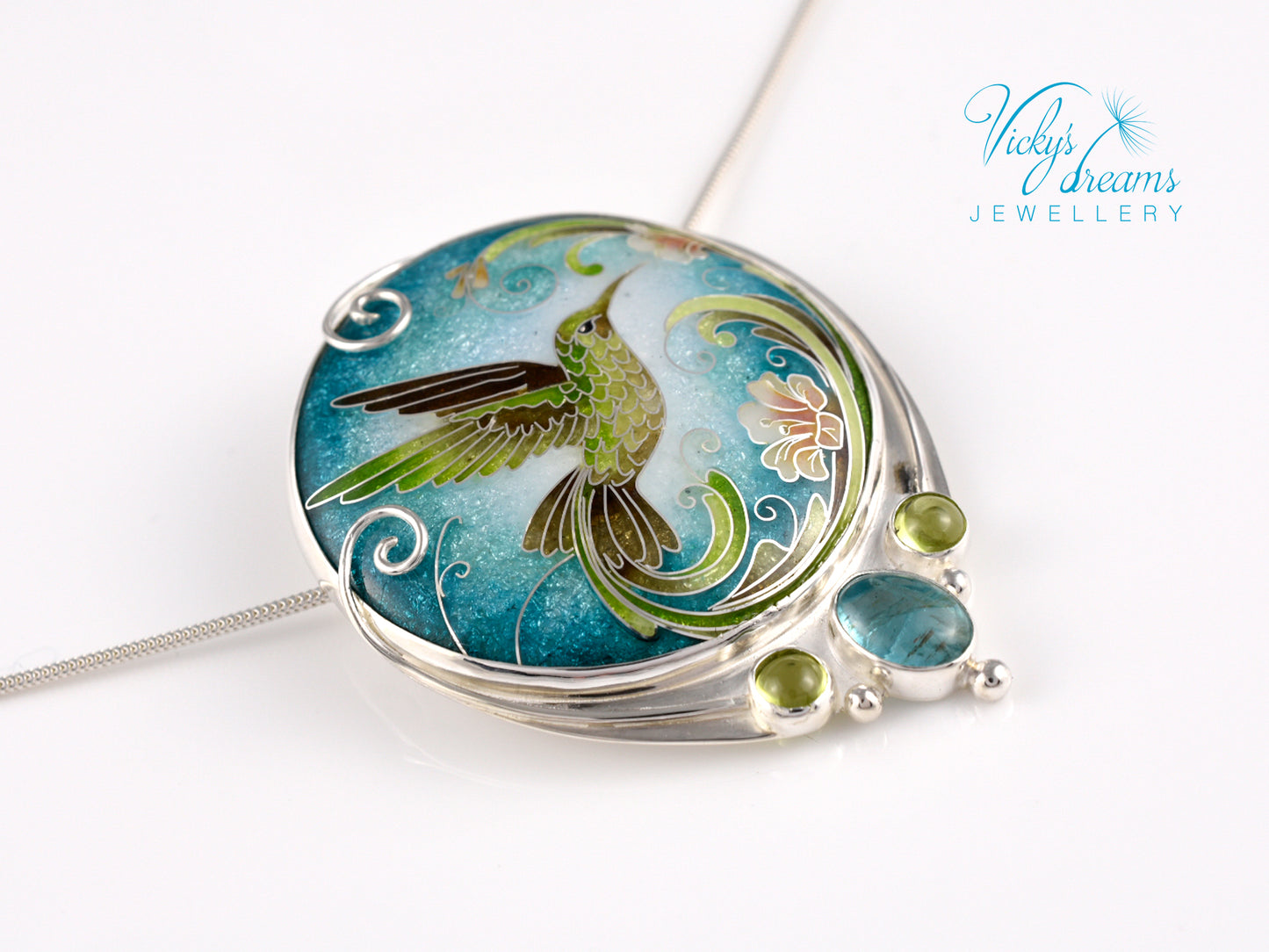 Handcrafted hummingbird pendant with cloisonné enamel and gemstone accents