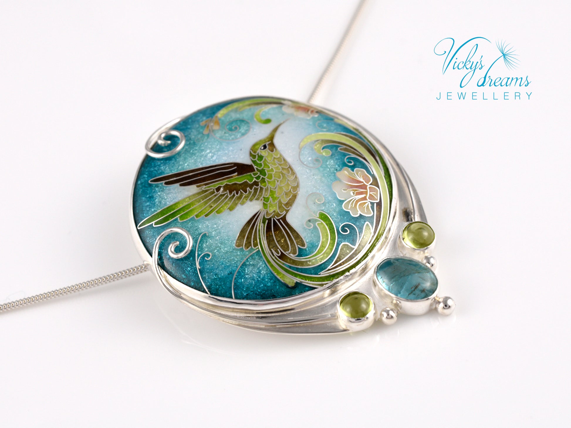 Handcrafted hummingbird pendant with cloisonné enamel and gemstone accents