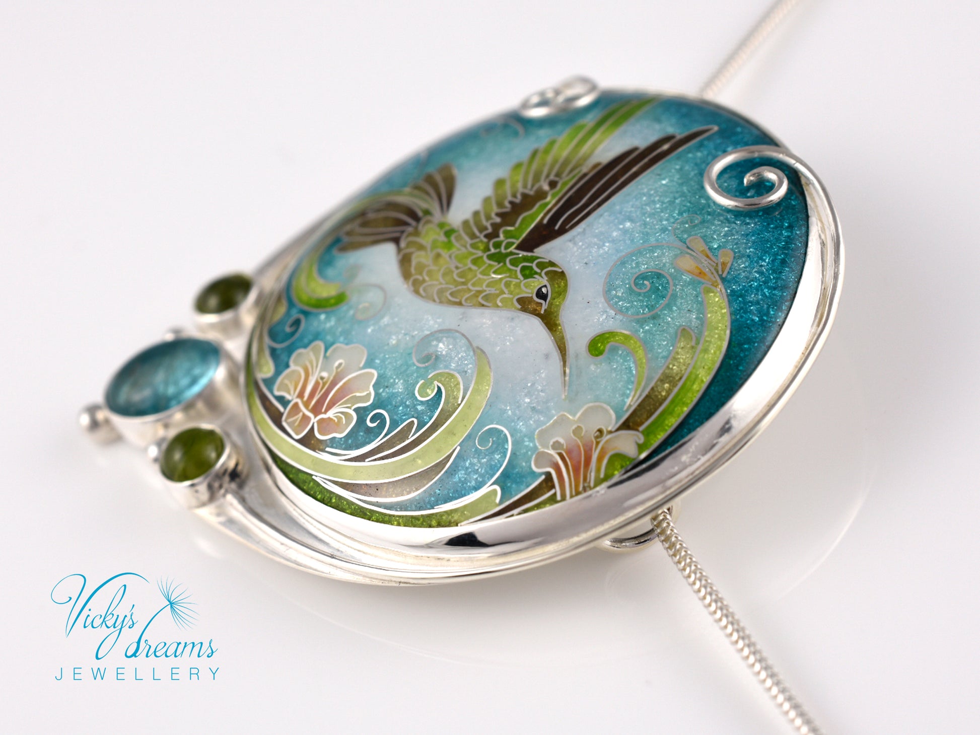 Handcrafted hummingbird pendant with cloisonné enamel and gemstone accents