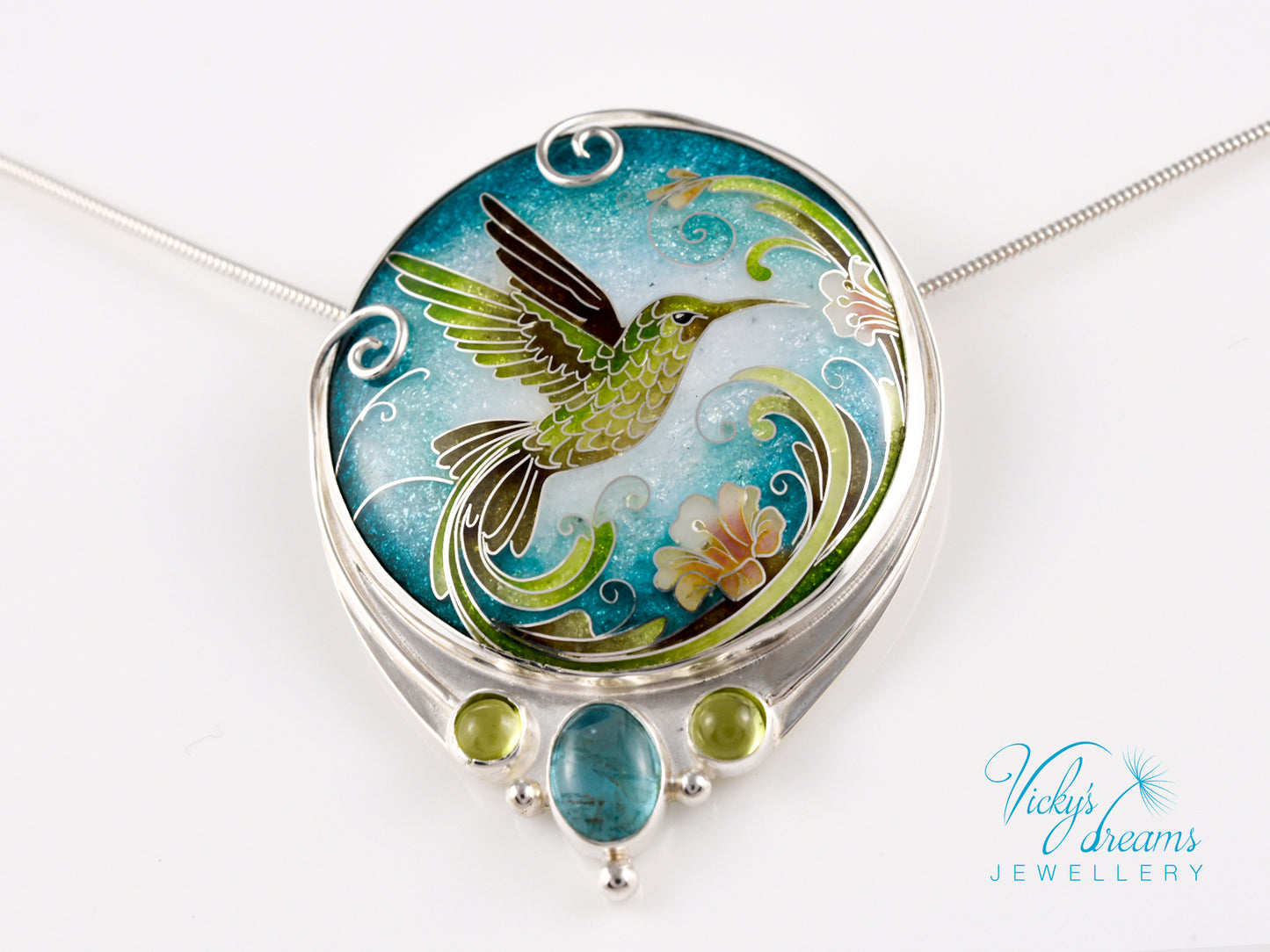 Handcrafted hummingbird pendant with cloisonné enamel and gemstone accents