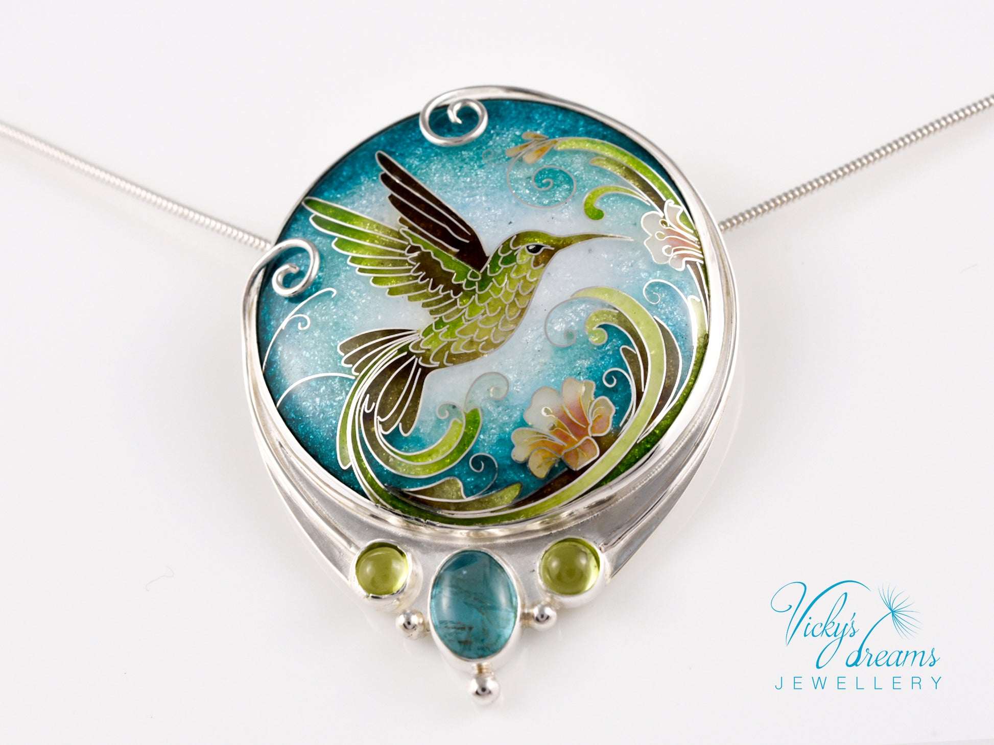 Handcrafted hummingbird pendant with cloisonné enamel and gemstone accents
