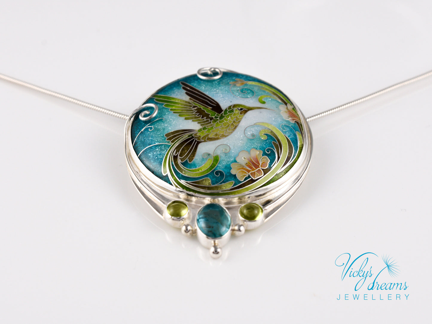 Handcrafted hummingbird pendant with cloisonné enamel and gemstone accents