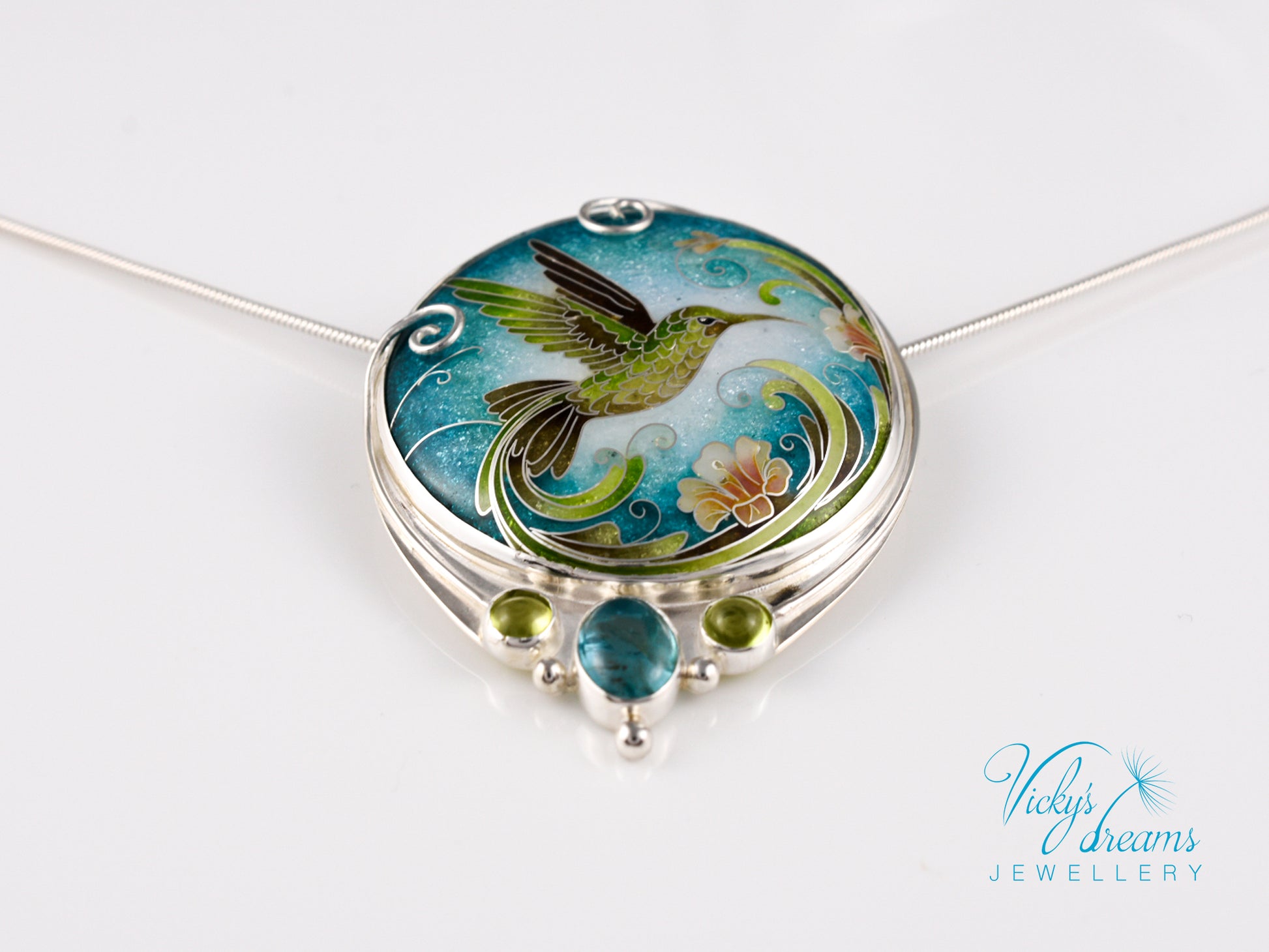 Handcrafted hummingbird pendant with cloisonné enamel and gemstone accents