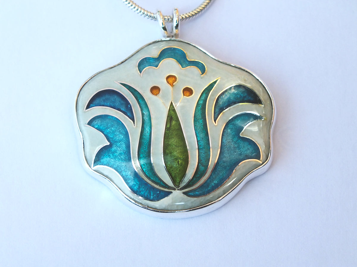 Decorative pendant with floral design on a white background