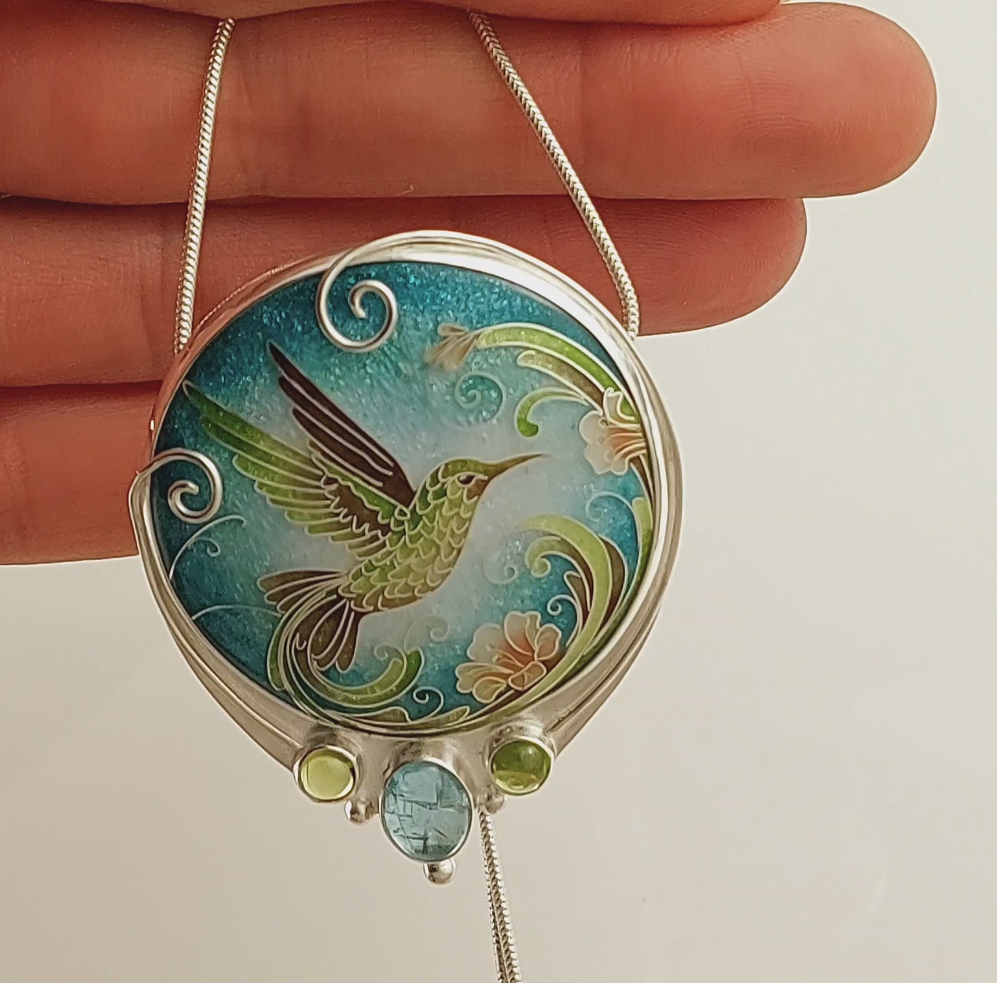 Handcrafted hummingbird pendant with cloisonné enamel and gemstone accents