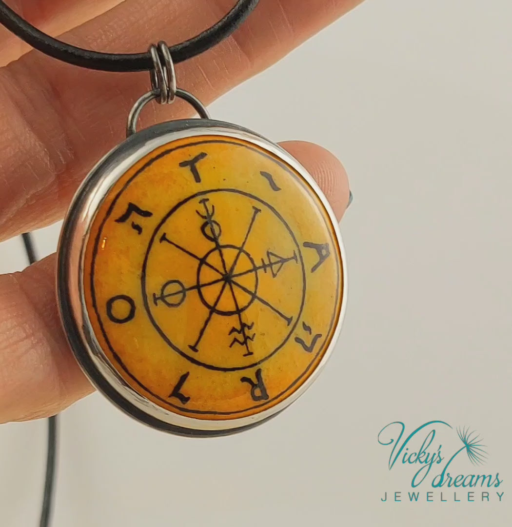 Hand painted enamel Wheel of Fortune tarot pendant in sterling silver and copper with leather cord