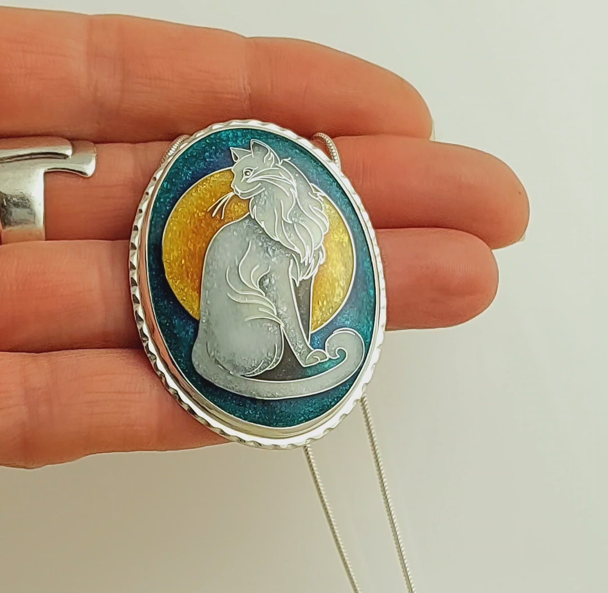 Handcrafted cloisonné cat pendant necklace with vibrant turquoise and yellow enamel