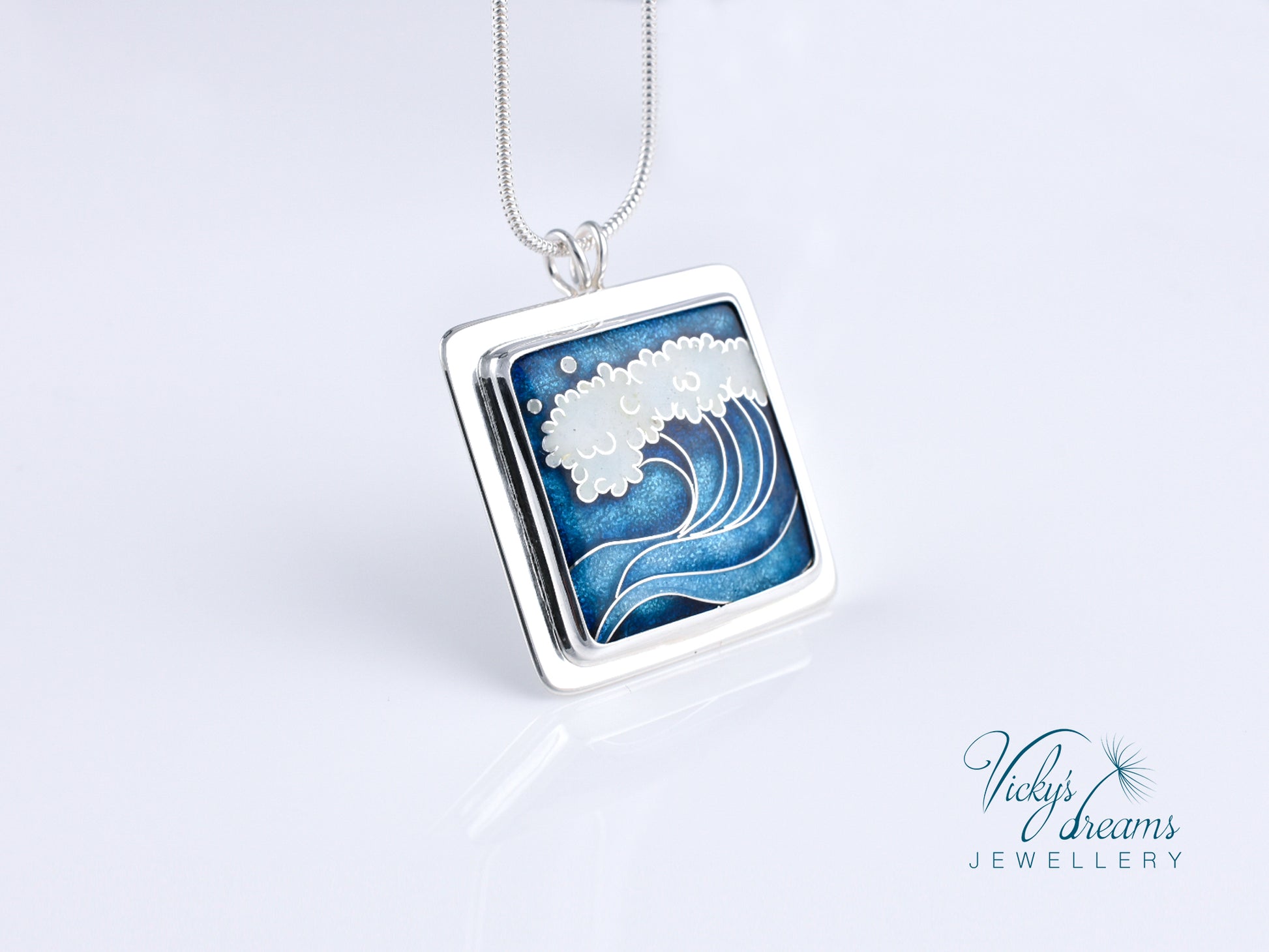 Cloisonné enamel necklace with blue and white sea wave design