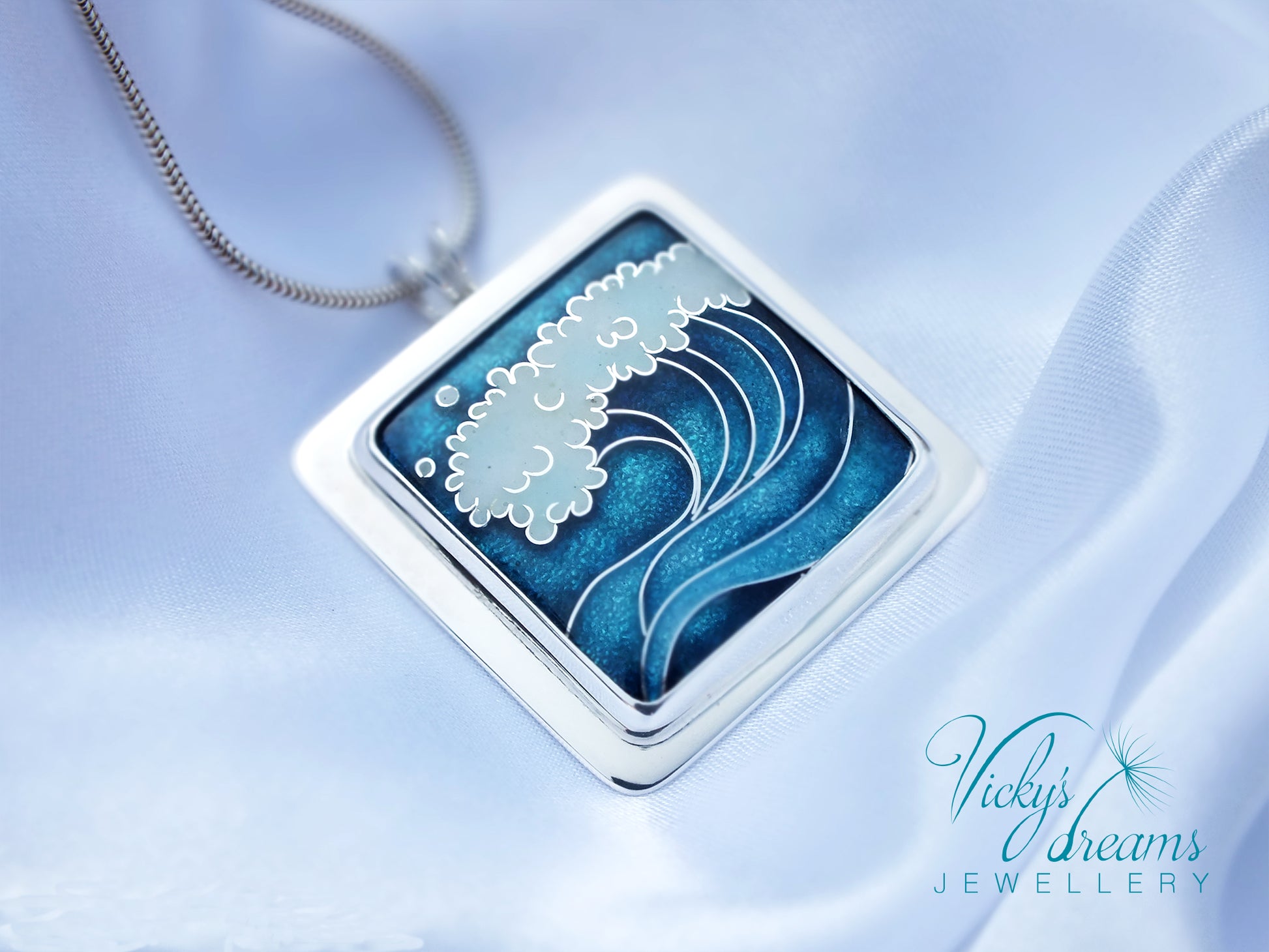 Cloisonné enamel necklace with blue and white sea wave design