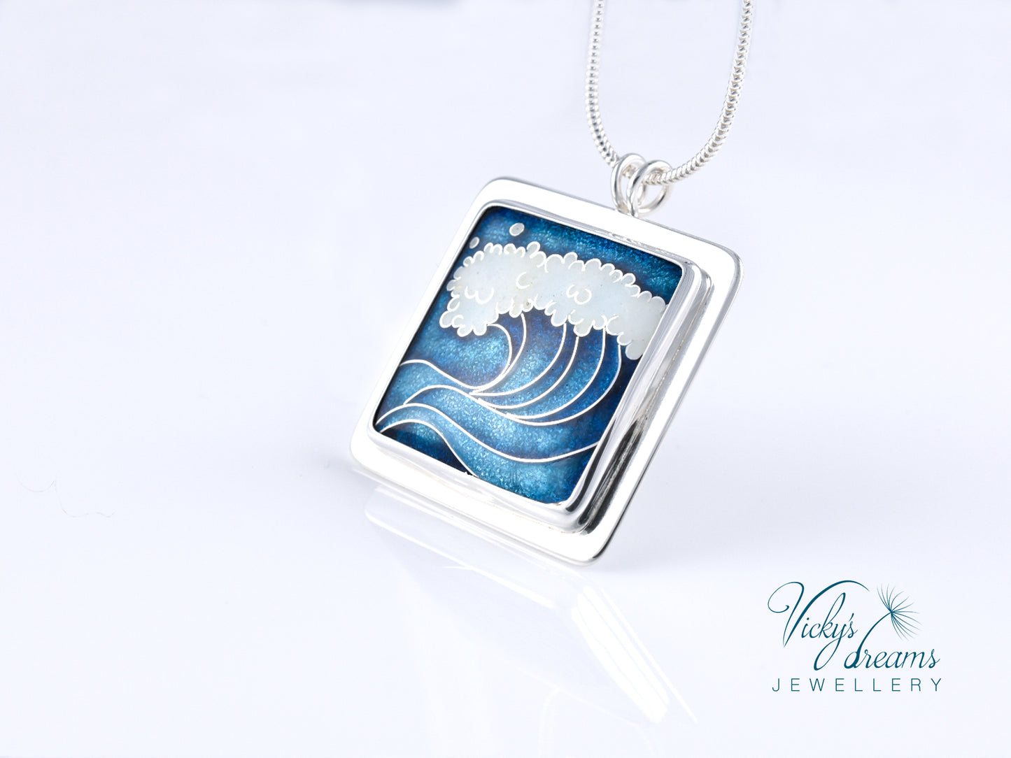 Cloisonné enamel necklace with blue and white sea wave design