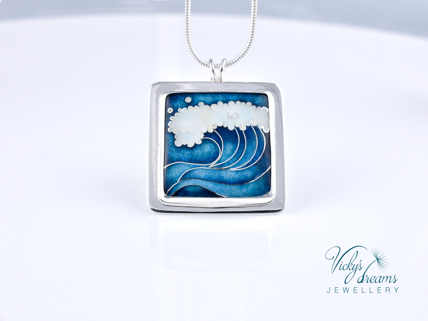 Cloisonné enamel necklace with blue and white sea wave design