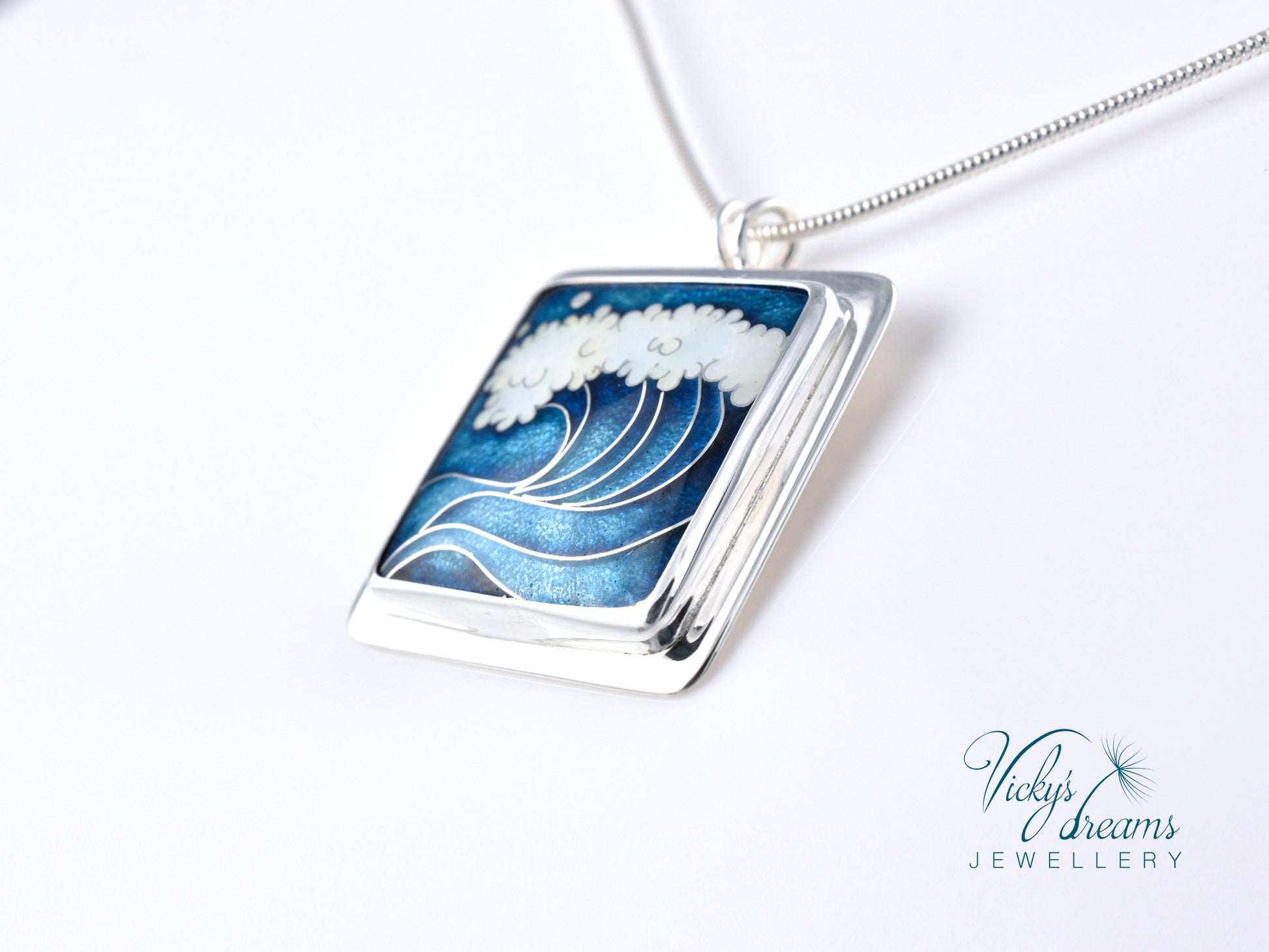 Cloisonné enamel necklace with blue and white sea wave design