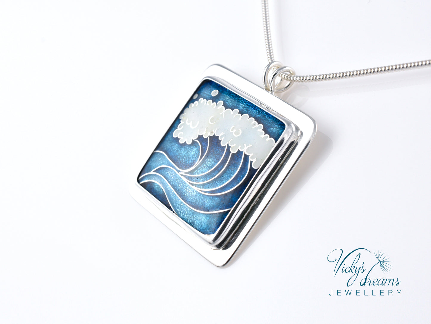 Cloisonné enamel necklace with blue and white sea wave design