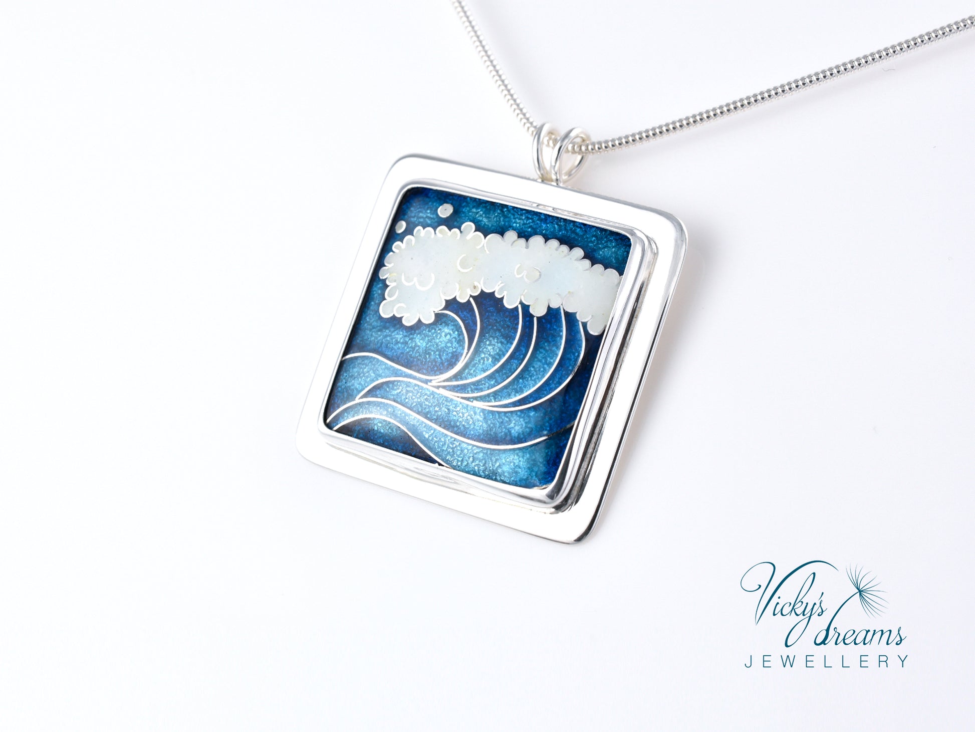 Cloisonné enamel necklace with blue and white sea wave design