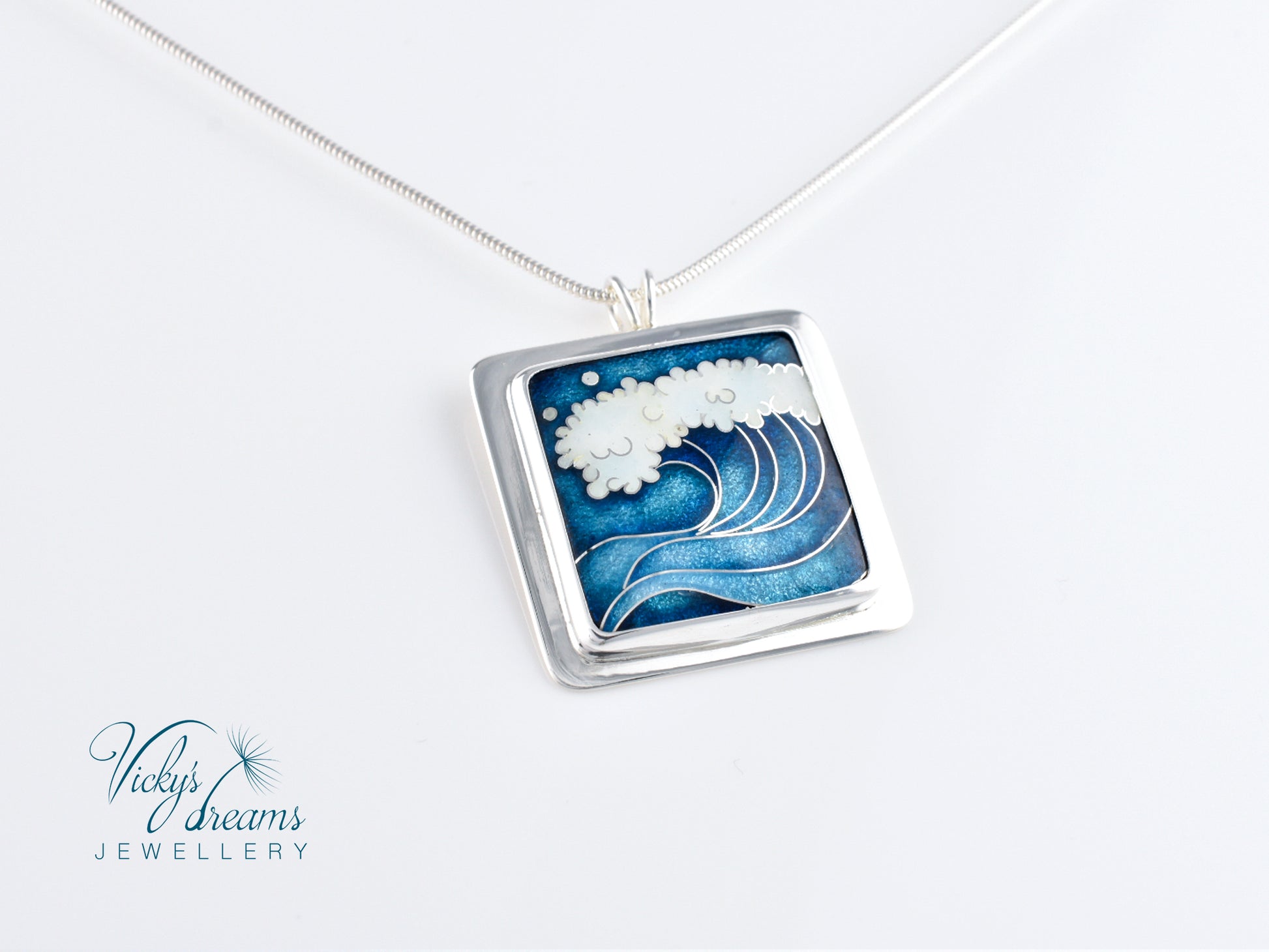 Cloisonné enamel necklace with blue and white sea wave design
