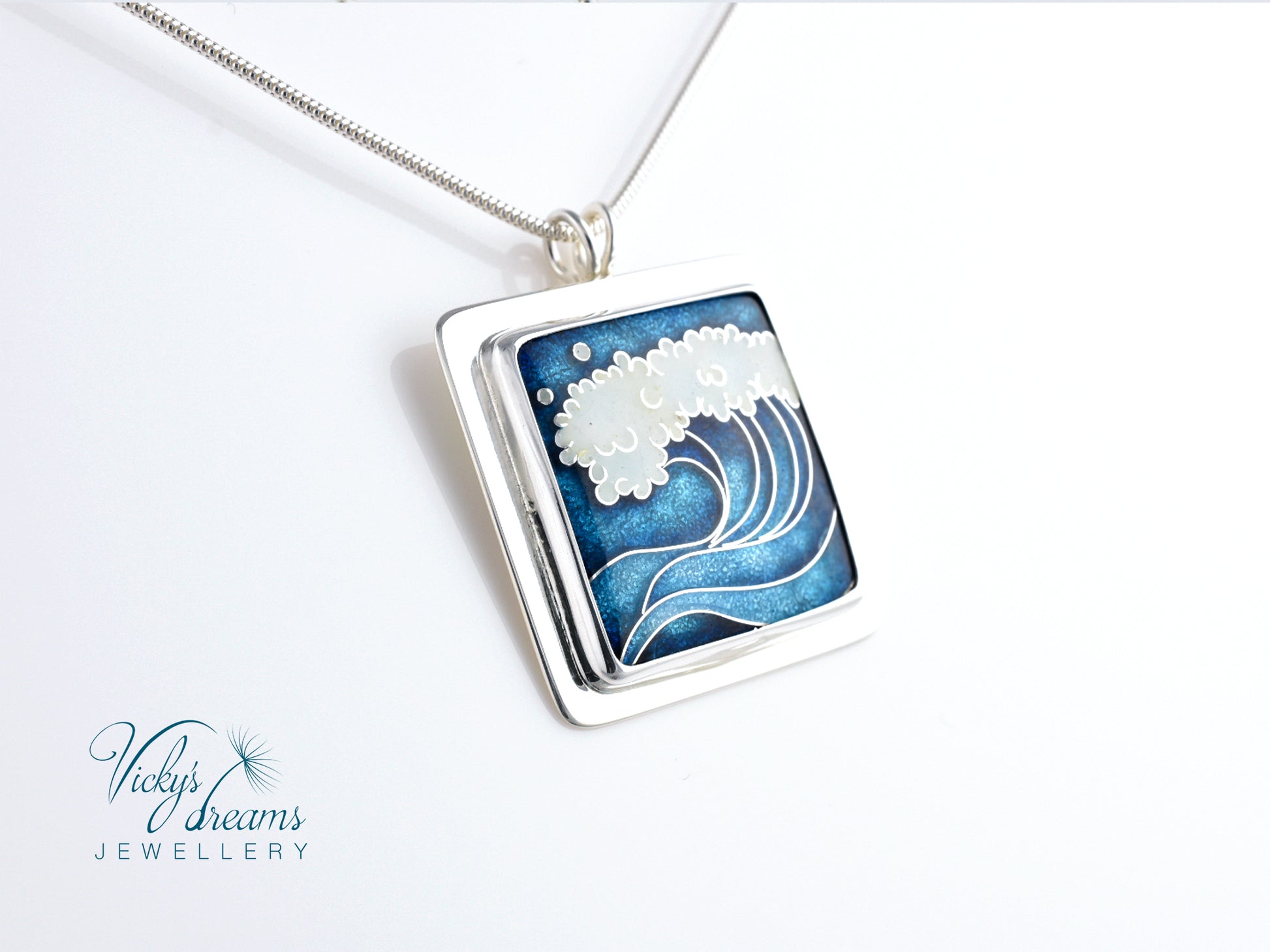 Cloisonné enamel necklace with blue and white sea wave design