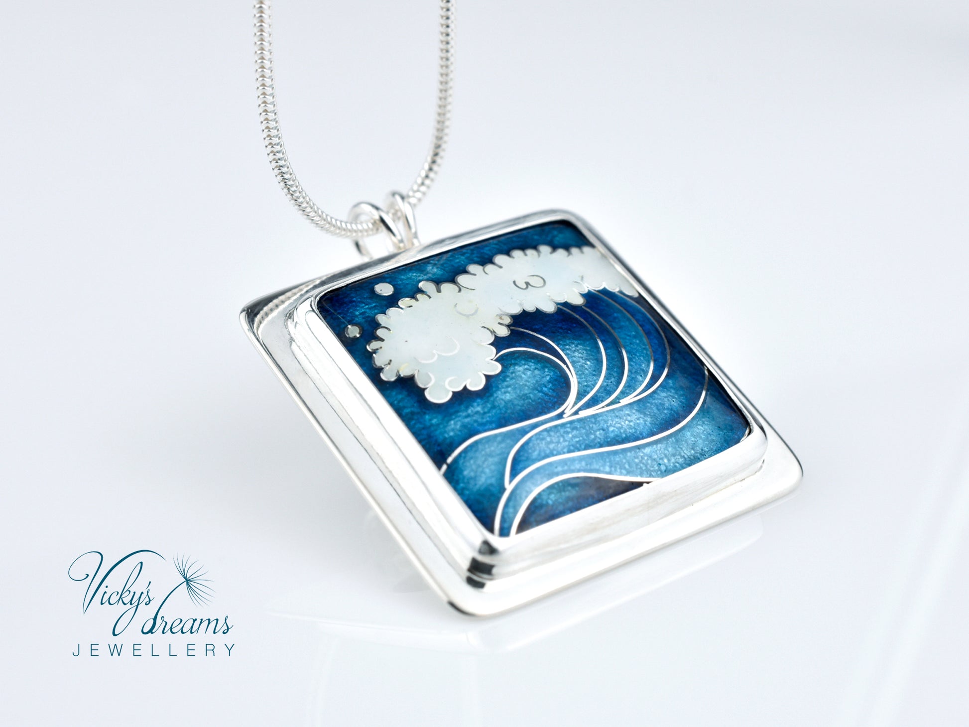 Cloisonné enamel necklace with blue and white sea wave design