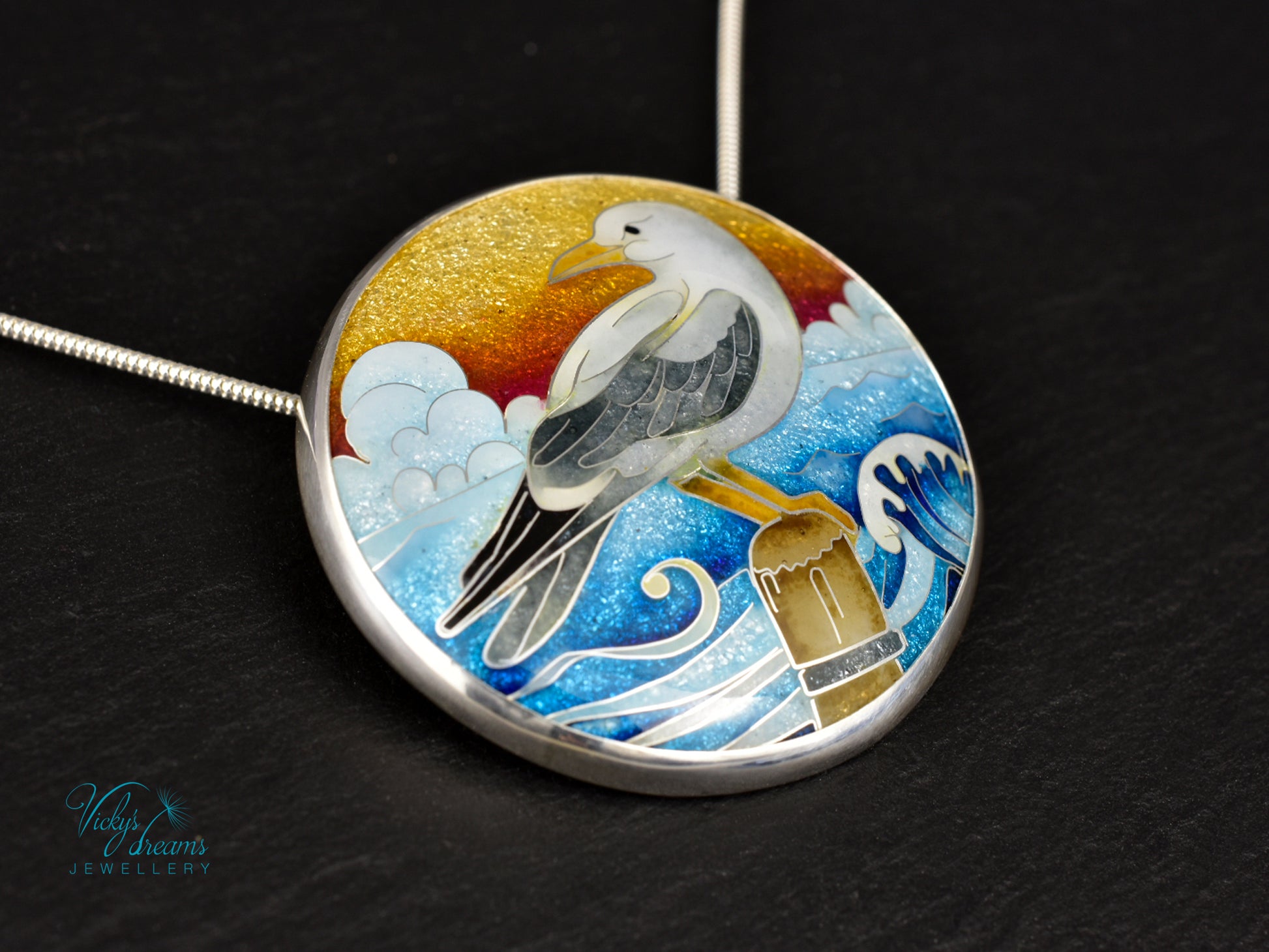 Handmade cloisonné seagull pendant necklace with sunset background