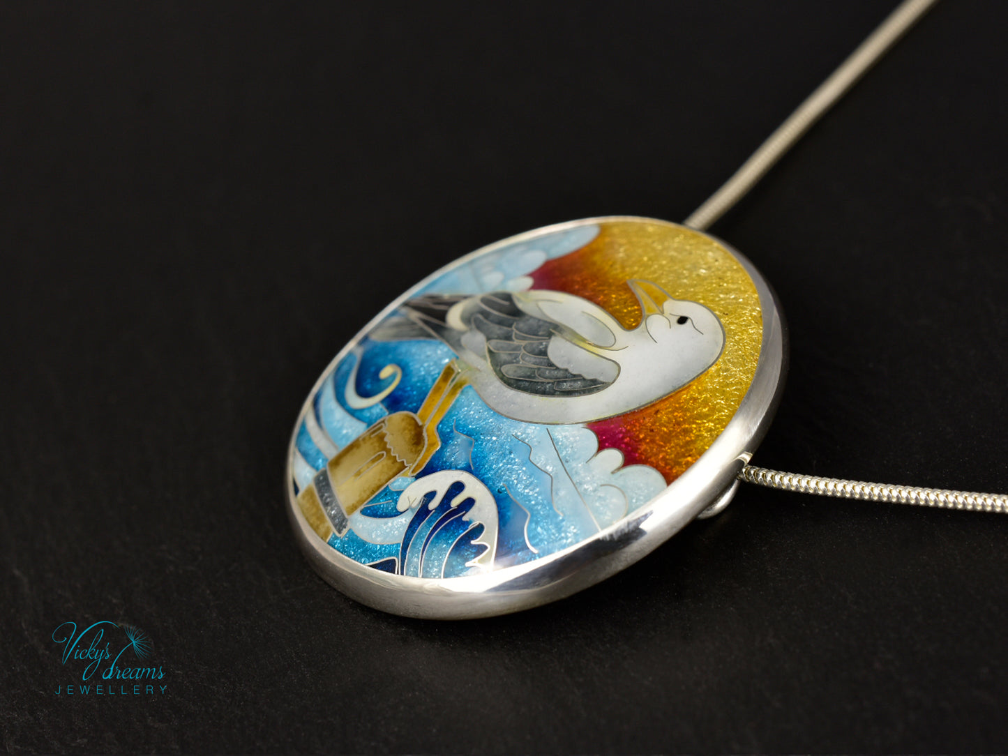 Handmade cloisonné seagull pendant necklace with sunset background