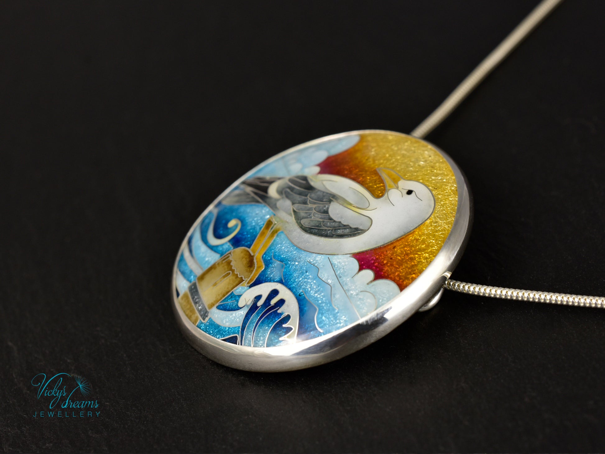 Handmade cloisonné seagull pendant necklace with sunset background