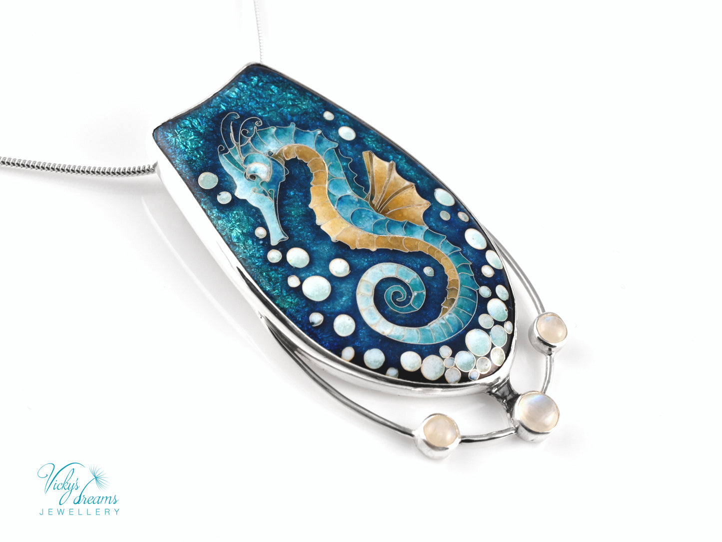Handcrafted cloisonné seahorse pendant with vibrant enamel colors and rainbow moonstones
