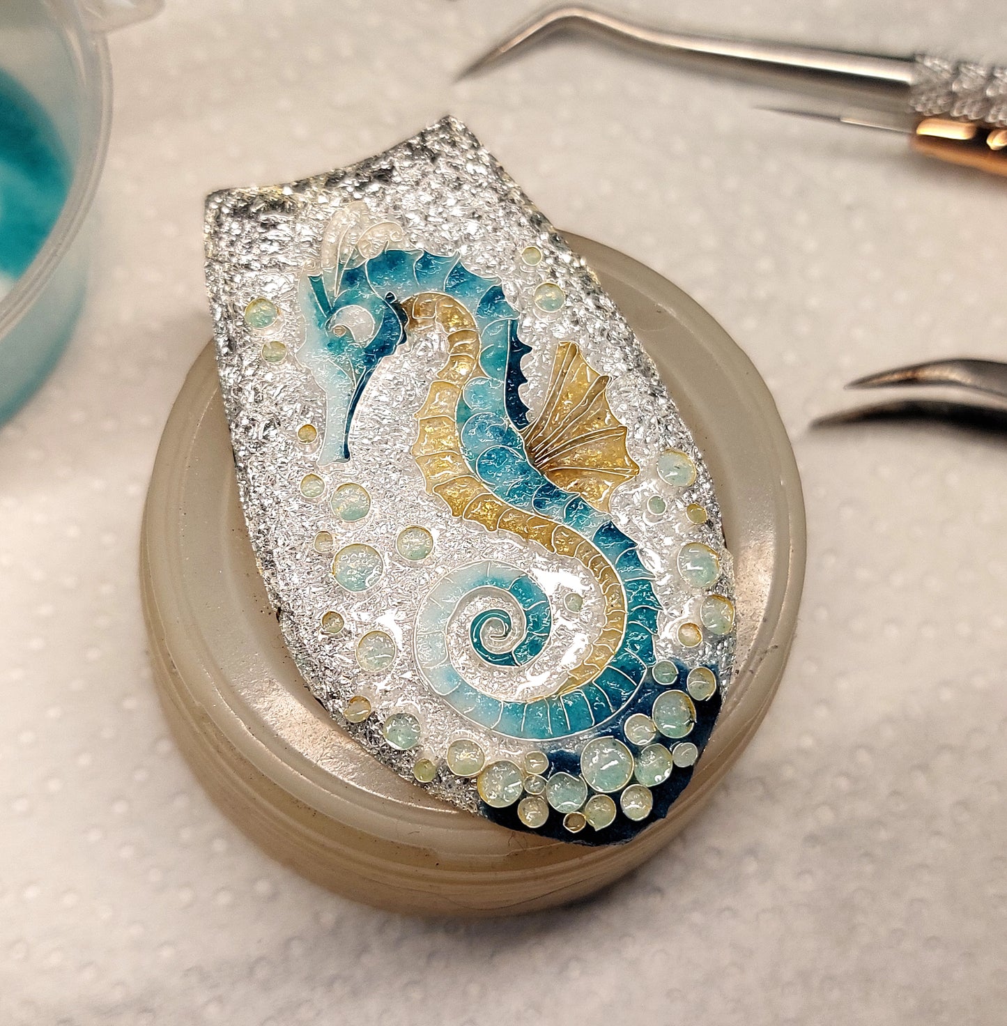 Handcrafted cloisonné seahorse pendant with vibrant enamel colors and rainbow moonstones