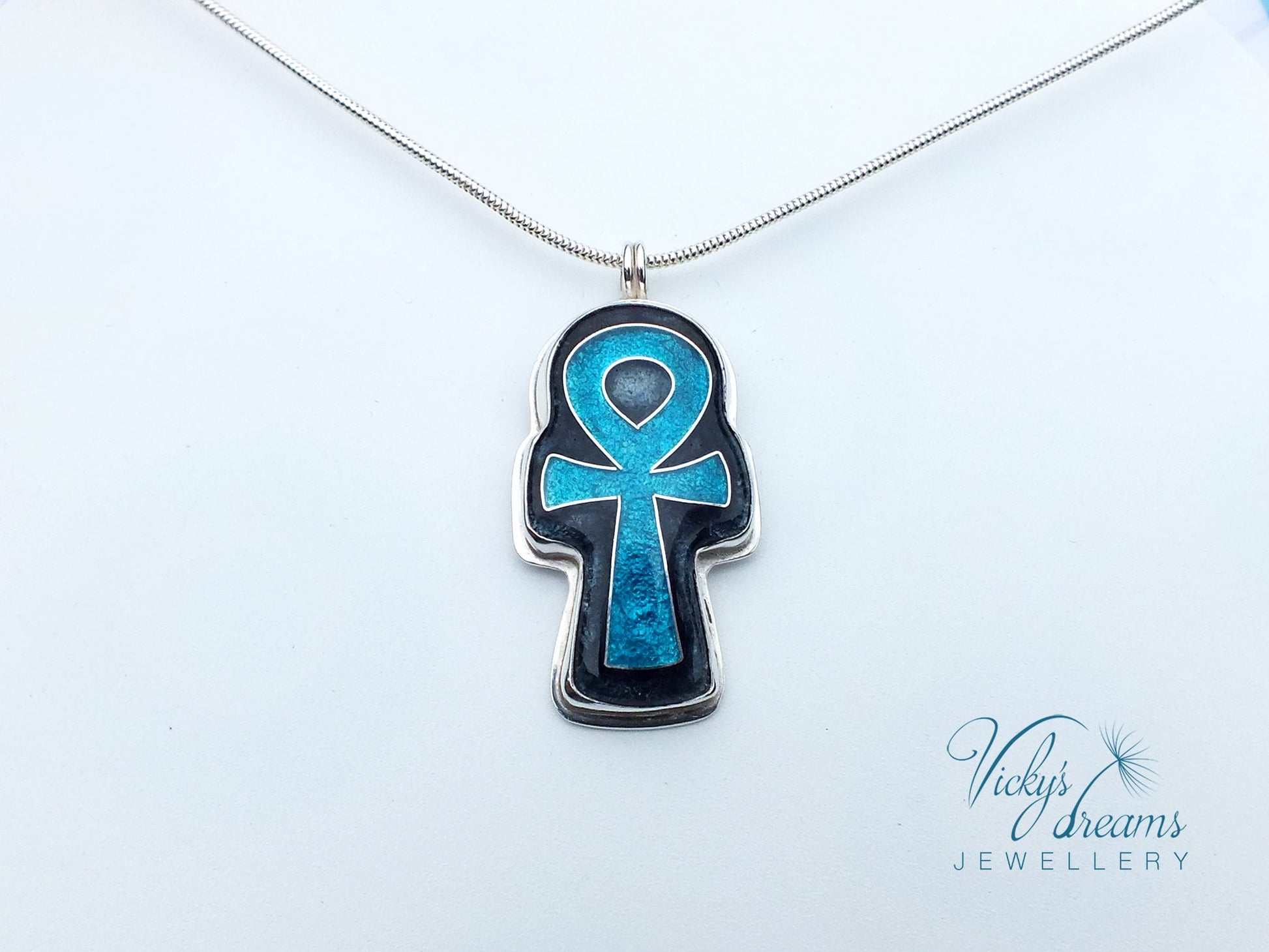 Handmade sterling silver Ankh pendant with colorful cloisonné enamel details.