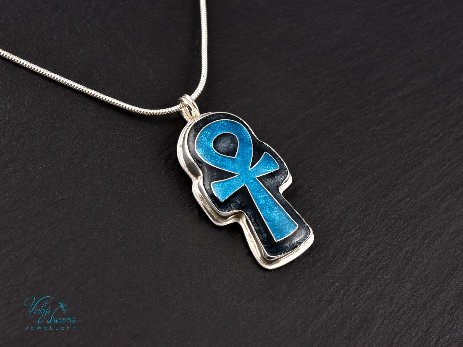 Handmade sterling silver Ankh pendant with colorful cloisonné enamel details.